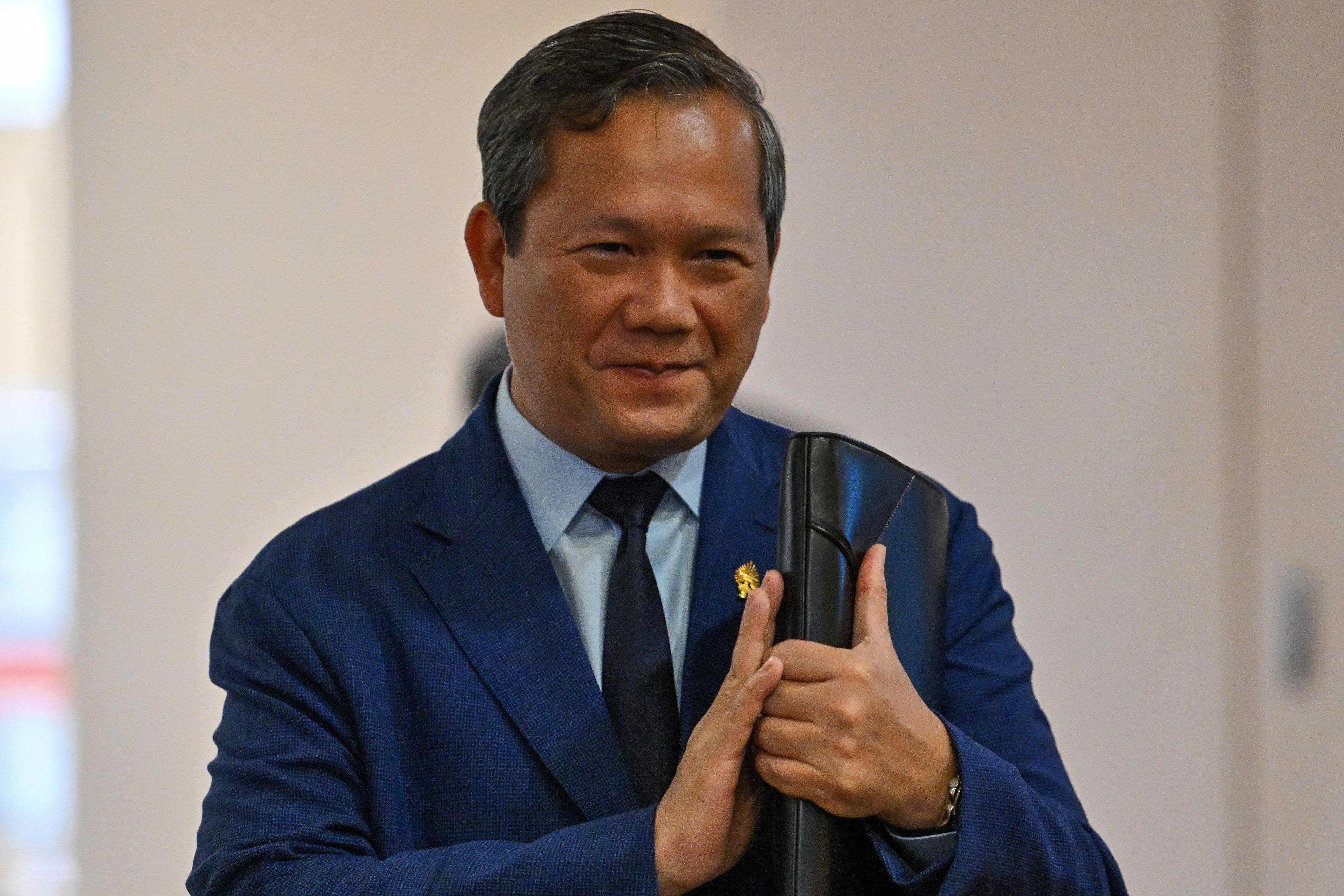 Cambodias Prime Minister Hun Manet arrives to attend a National Assembly meeting on Monday, where lawmakers passed legislation allowing for citizenship to be revoked. Photo: AFP