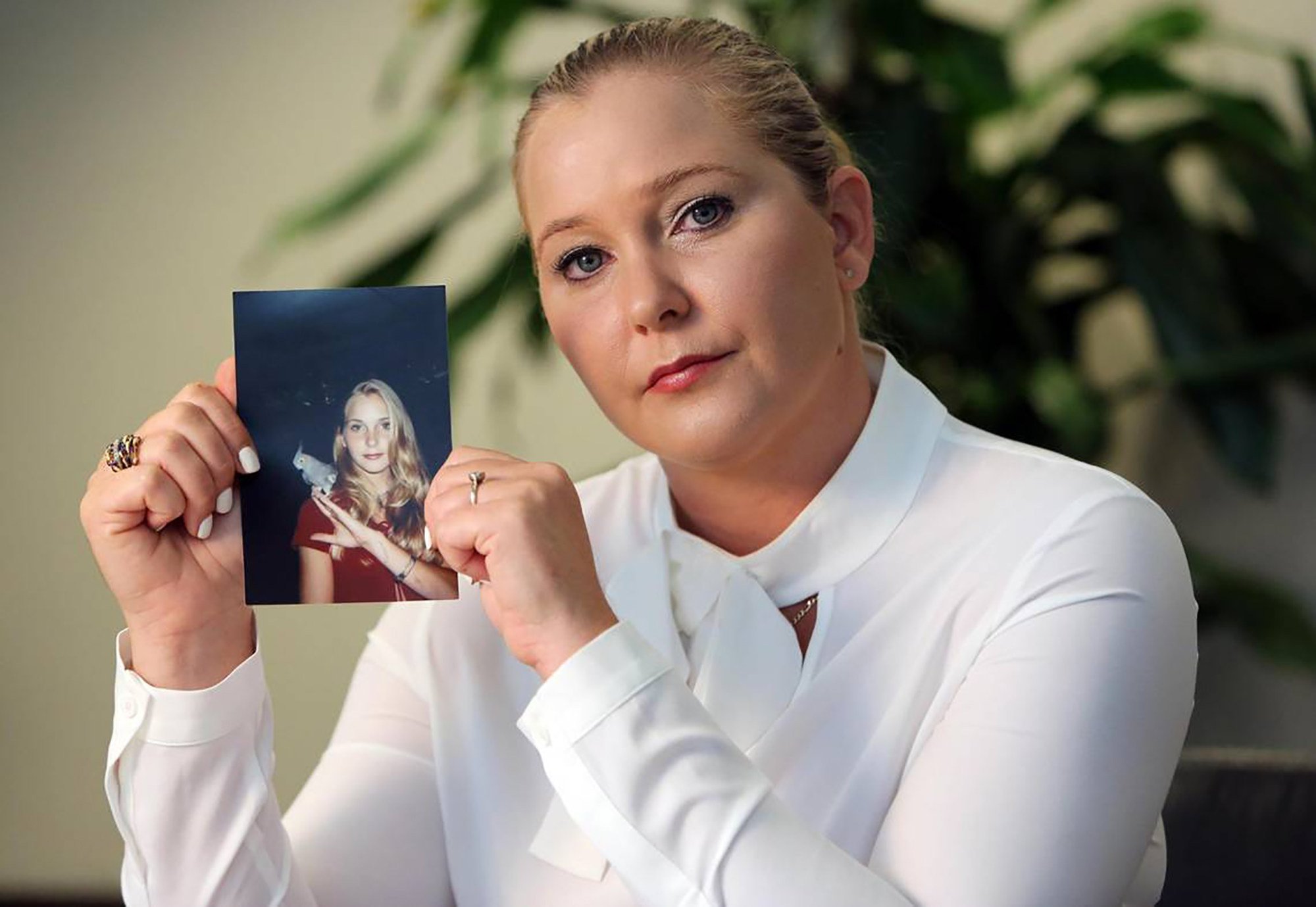 Virginia Giuffre with a photo of herself as a teenager, when she said she was abused by Jeffrey Epstein, Ghislaine Maxwell and Prince Andrew. Giuffre died by suicide in April. Photo: Miami Herald / TNS