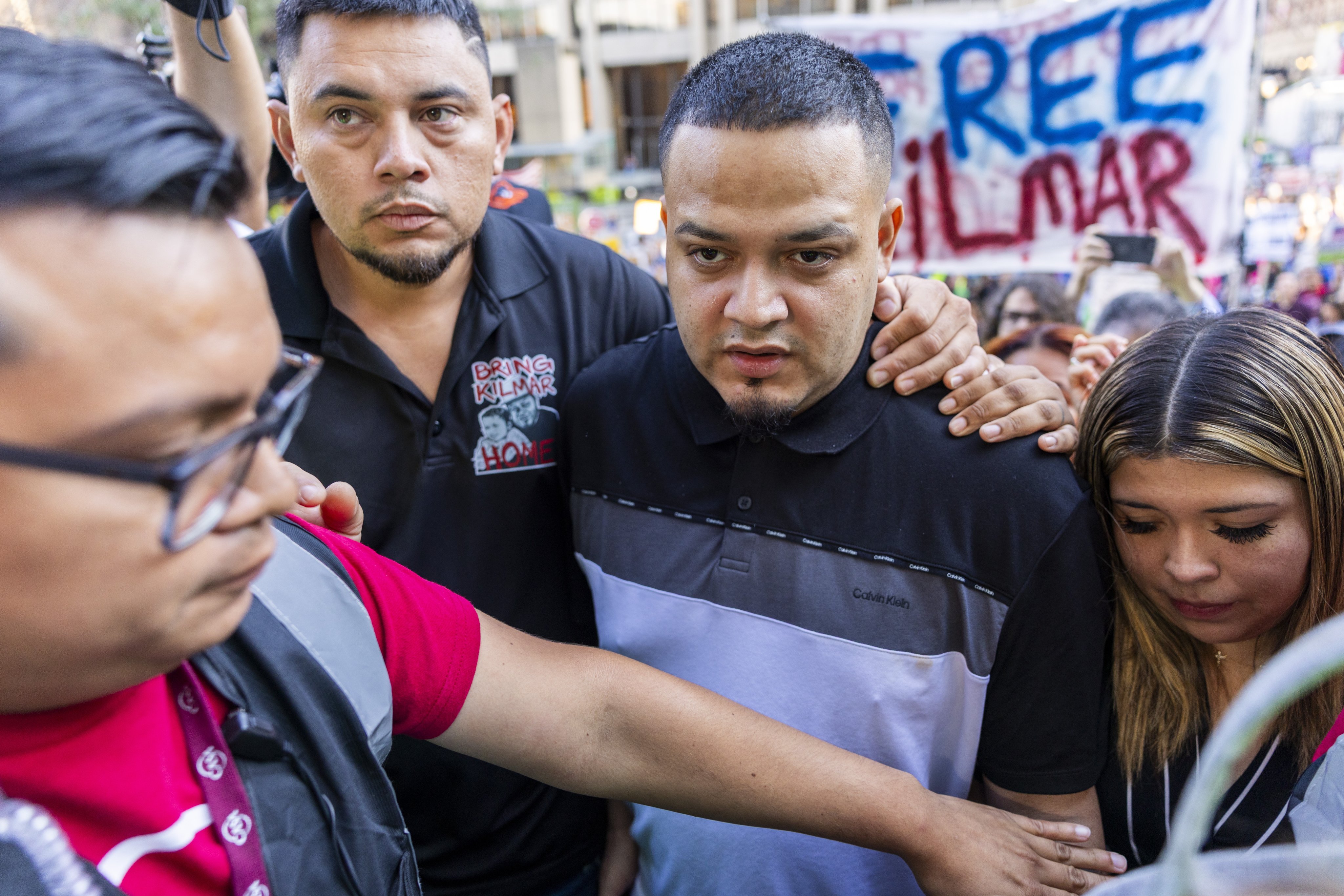 Kilmar Abrego Garcia (centre), with his wife Jennifer Vasquez Sura (right), walks to the ICE Baltimore Field Office in Baltimore on Monday. Photo: EPA