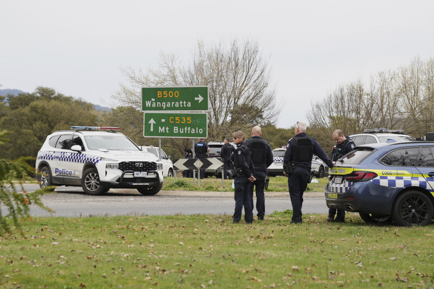 Australian police wait near the scene of a shooting in the state of Victoria, on Tuesday. Photo: AP