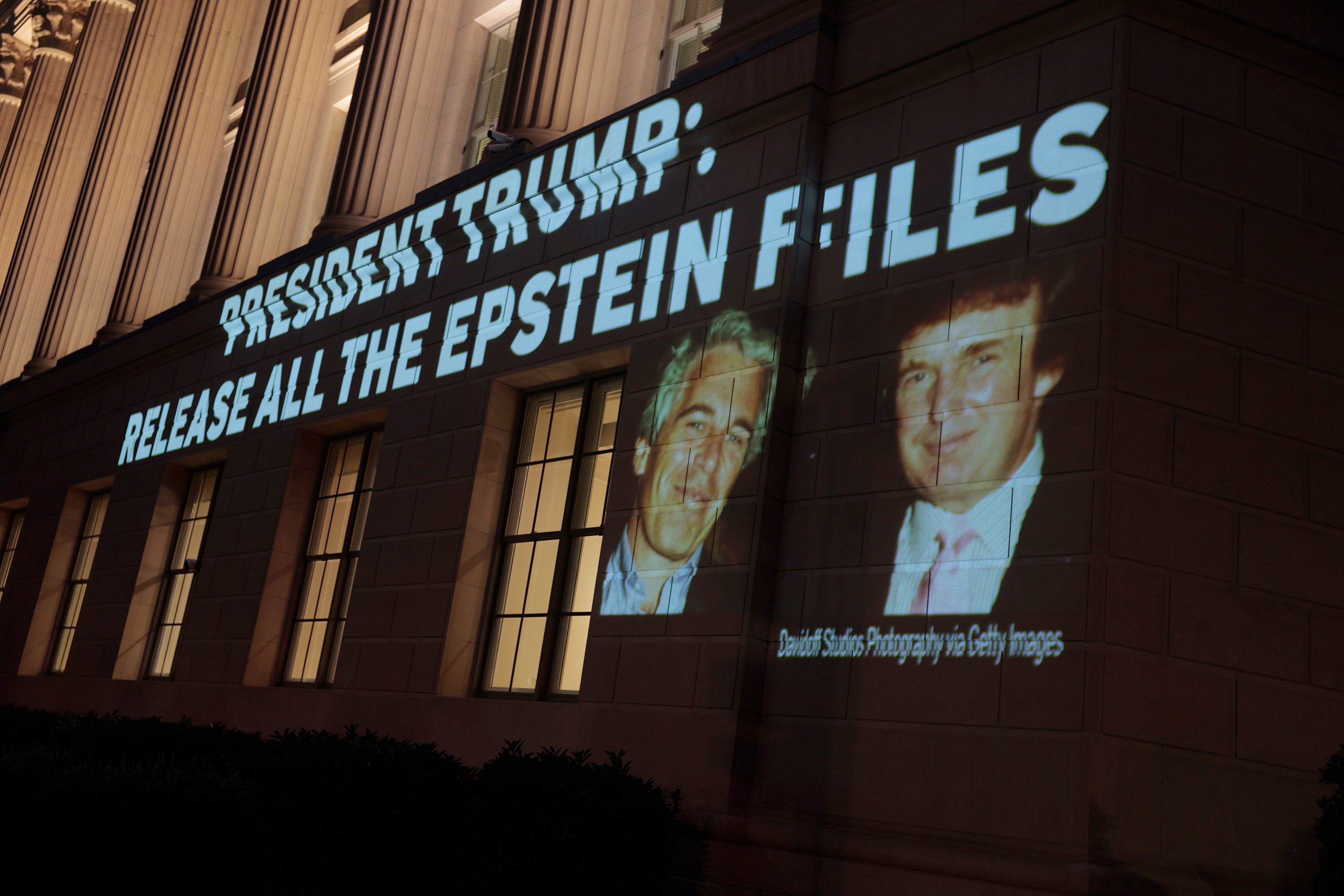 An image of US President Donald Trump and Jeffrey Epstein is projected on to the US Department of Commerce headquarters on July 18. Photo: Getty Images / TNS