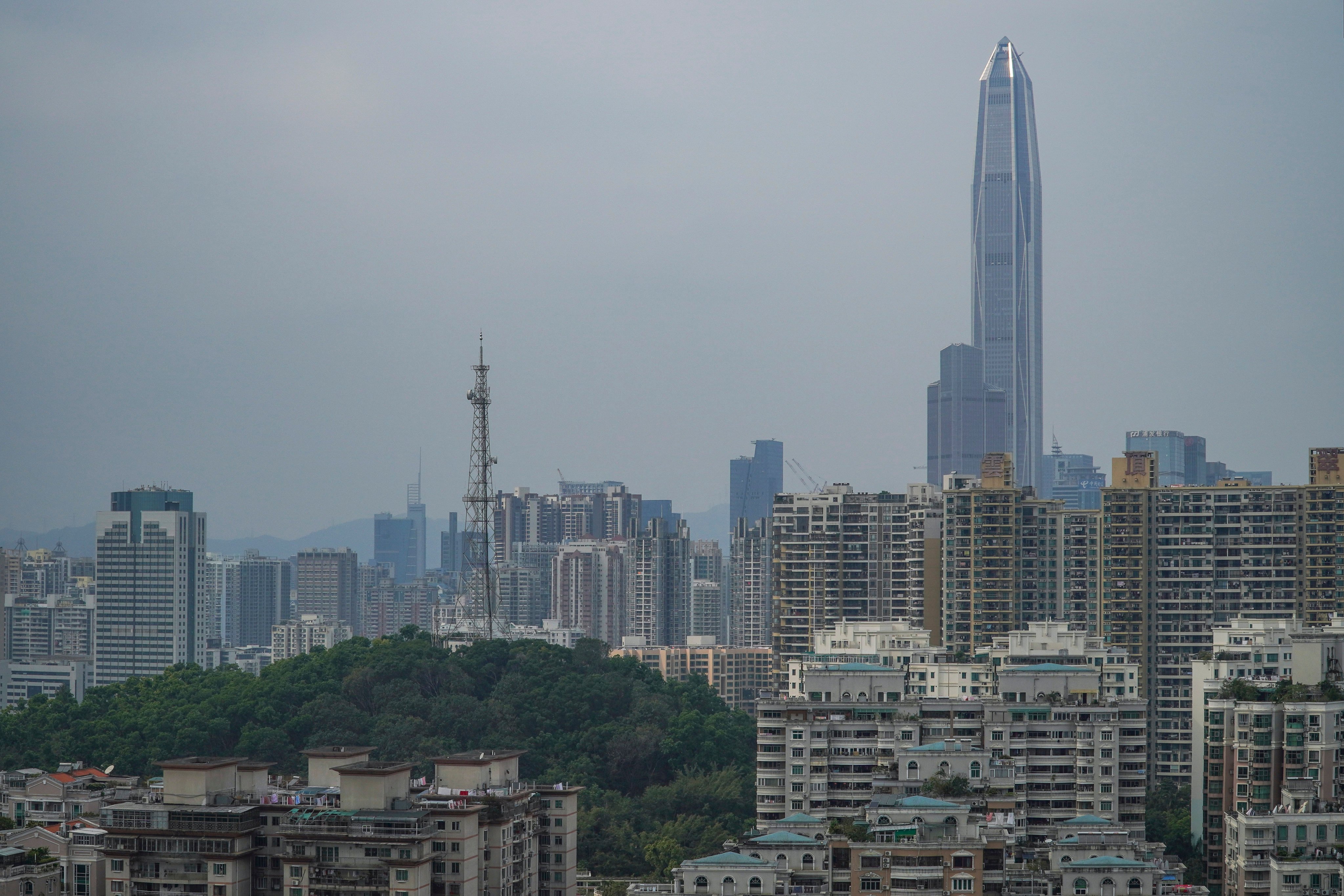 The Ping An International Finance Centre (PAFC) Phase 1 (right) looms over the skyline of Shenzhen’s Futian district on March 19, 2019. Photo: Roy Issa