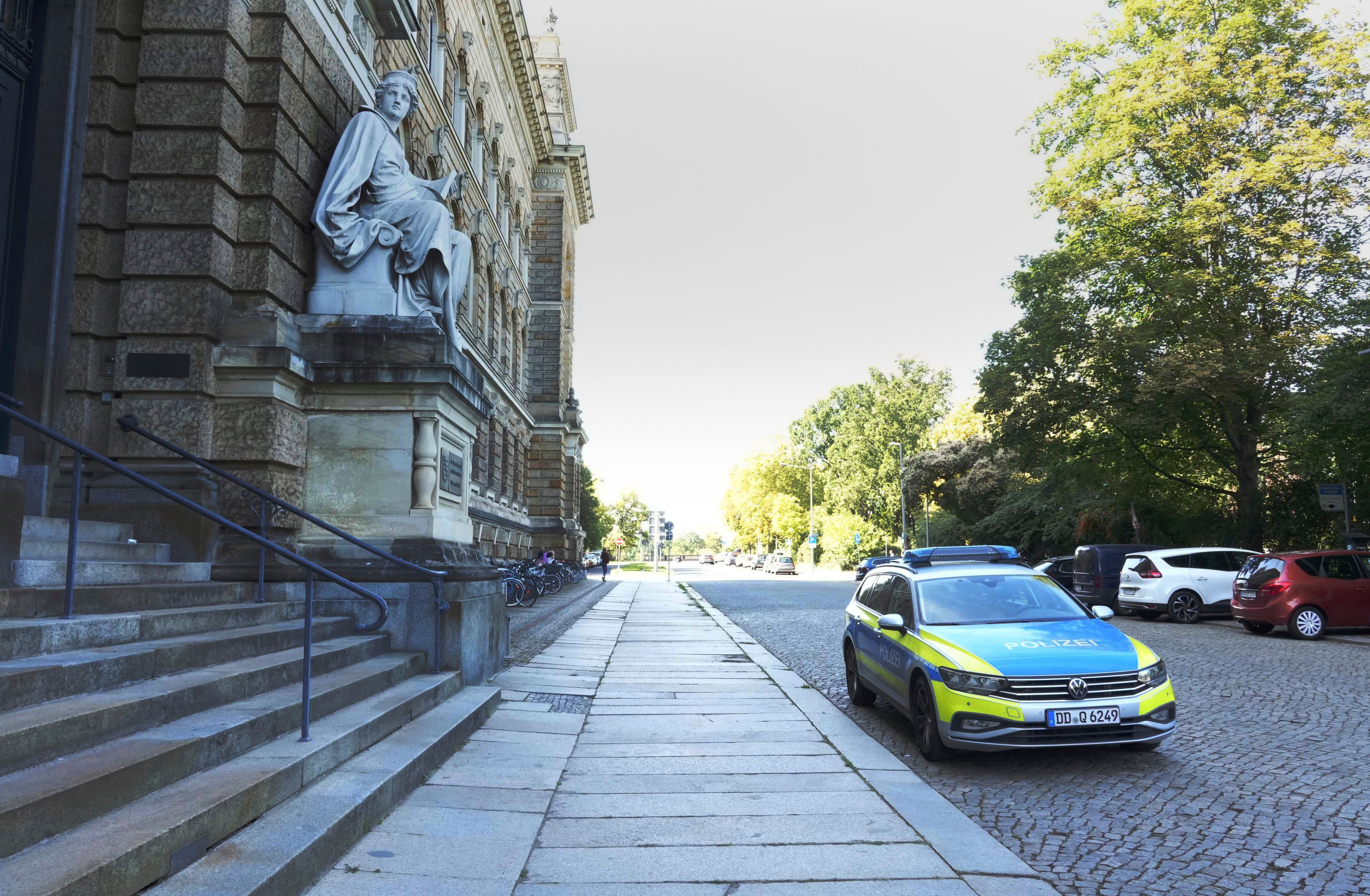 A police car in front of the prosecution building in Dresden, Germany. Photo: dpa via AP