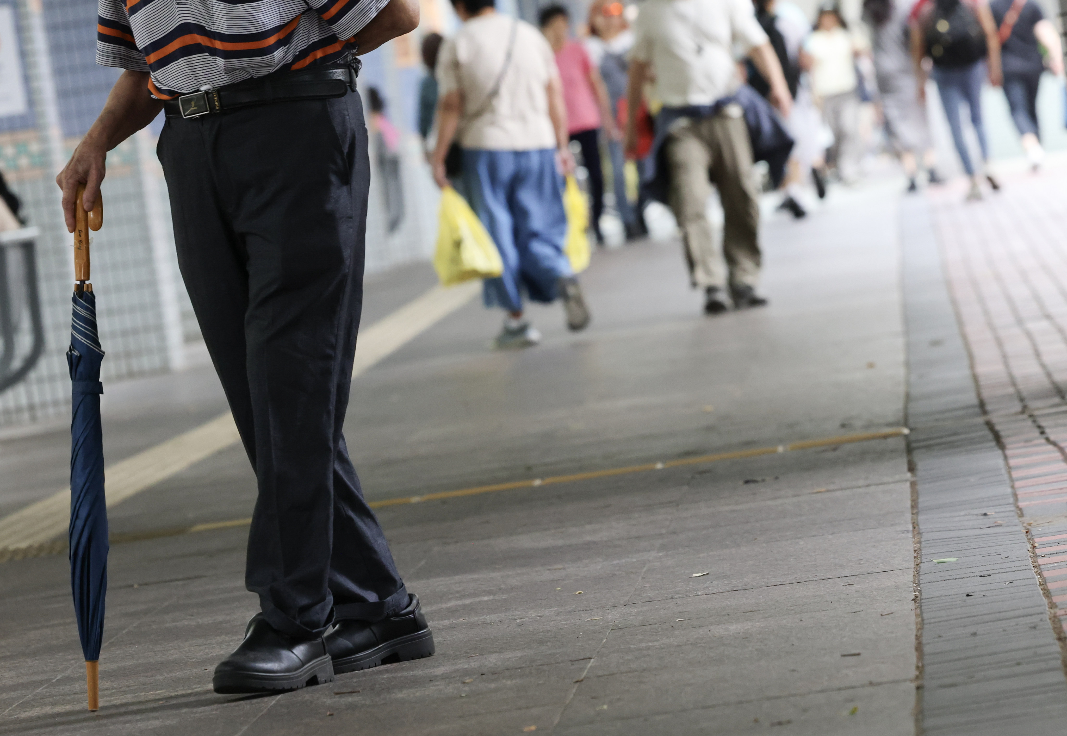 An elderly man walks around a housing estate in Cheung Sha Wan on May 9. Photo: Jelly Tse