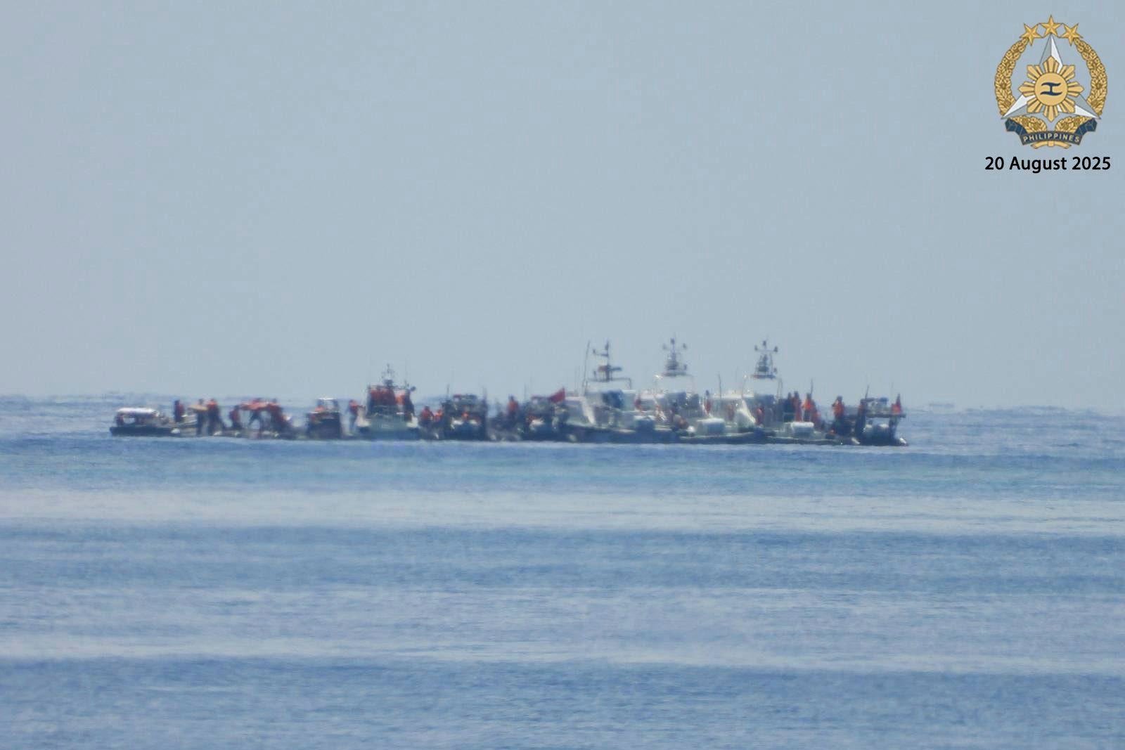 Chinese vessels, some mounted with armaments, are seen close to Philippine warship BRP Sierra Madre in the South China Sea on August 20. Photo: Armed Forces of the Philippines/AP