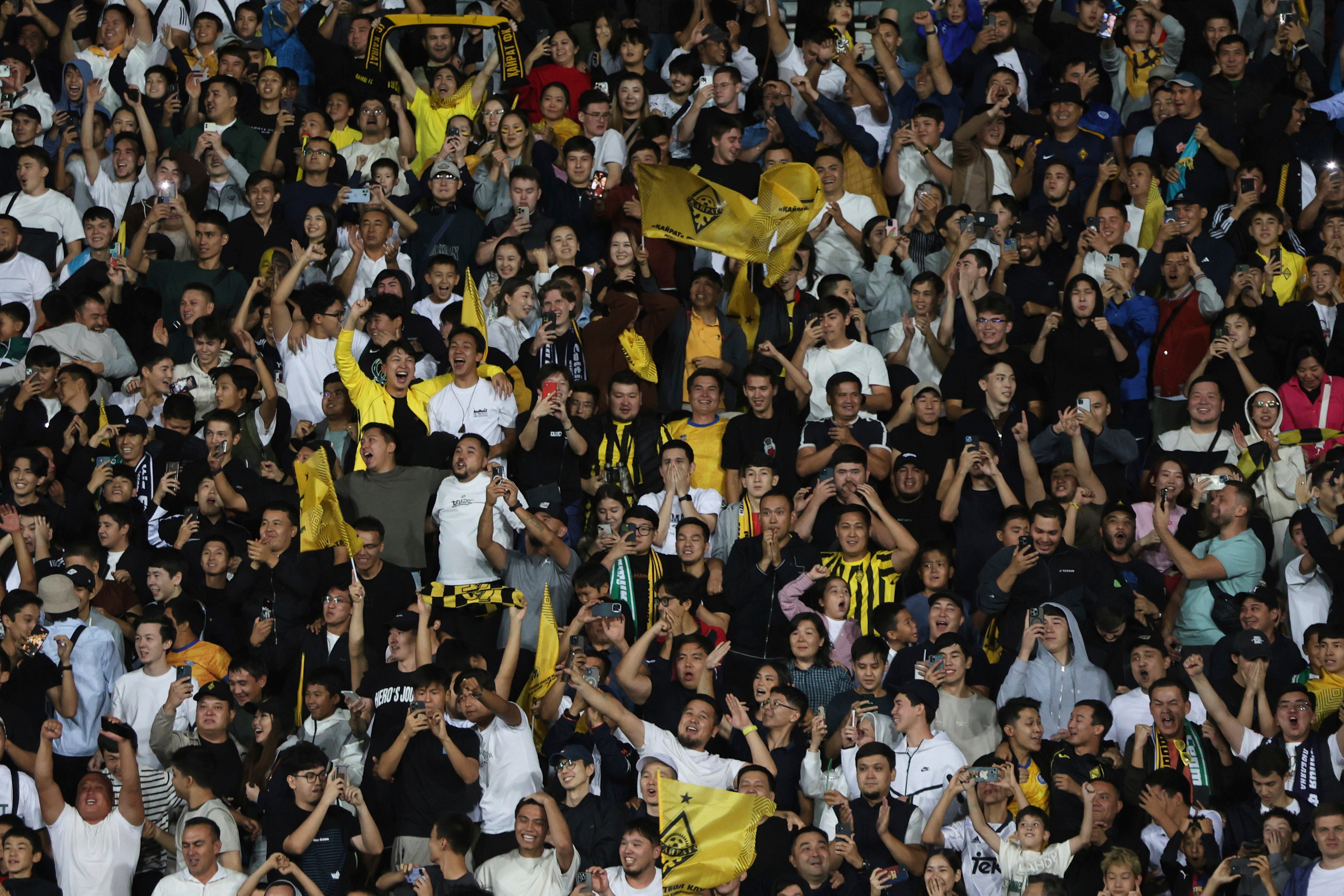 Almaty Kairat fans celebrate their team’s Champions League play-off win over Celtic. Photo: AP