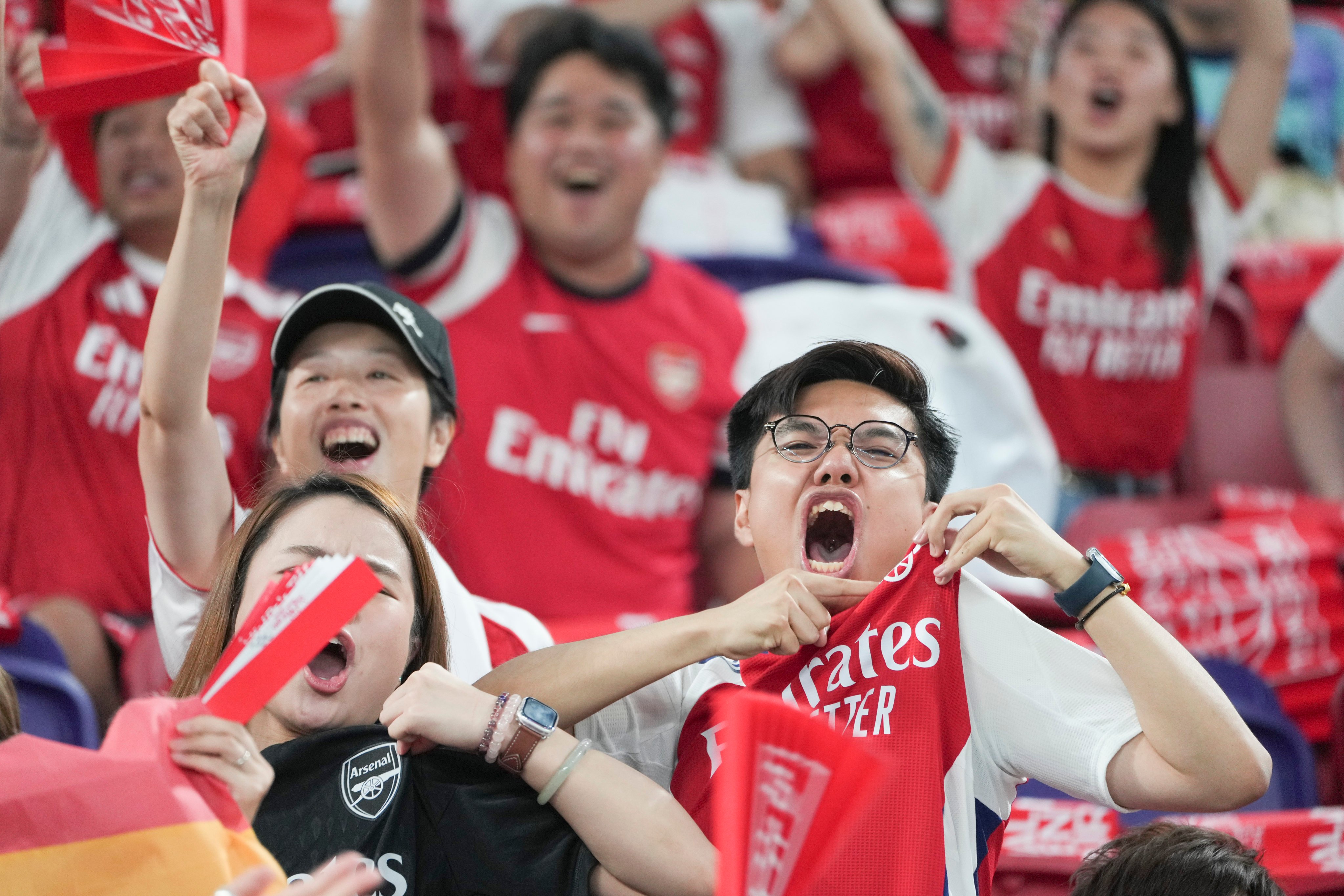 Fans watch the match between Arsenal and Tottenham Hotspur during the Hong Kong Football Festival at Kai Tak Sports Park on July 31. Photo: Sam Tsang