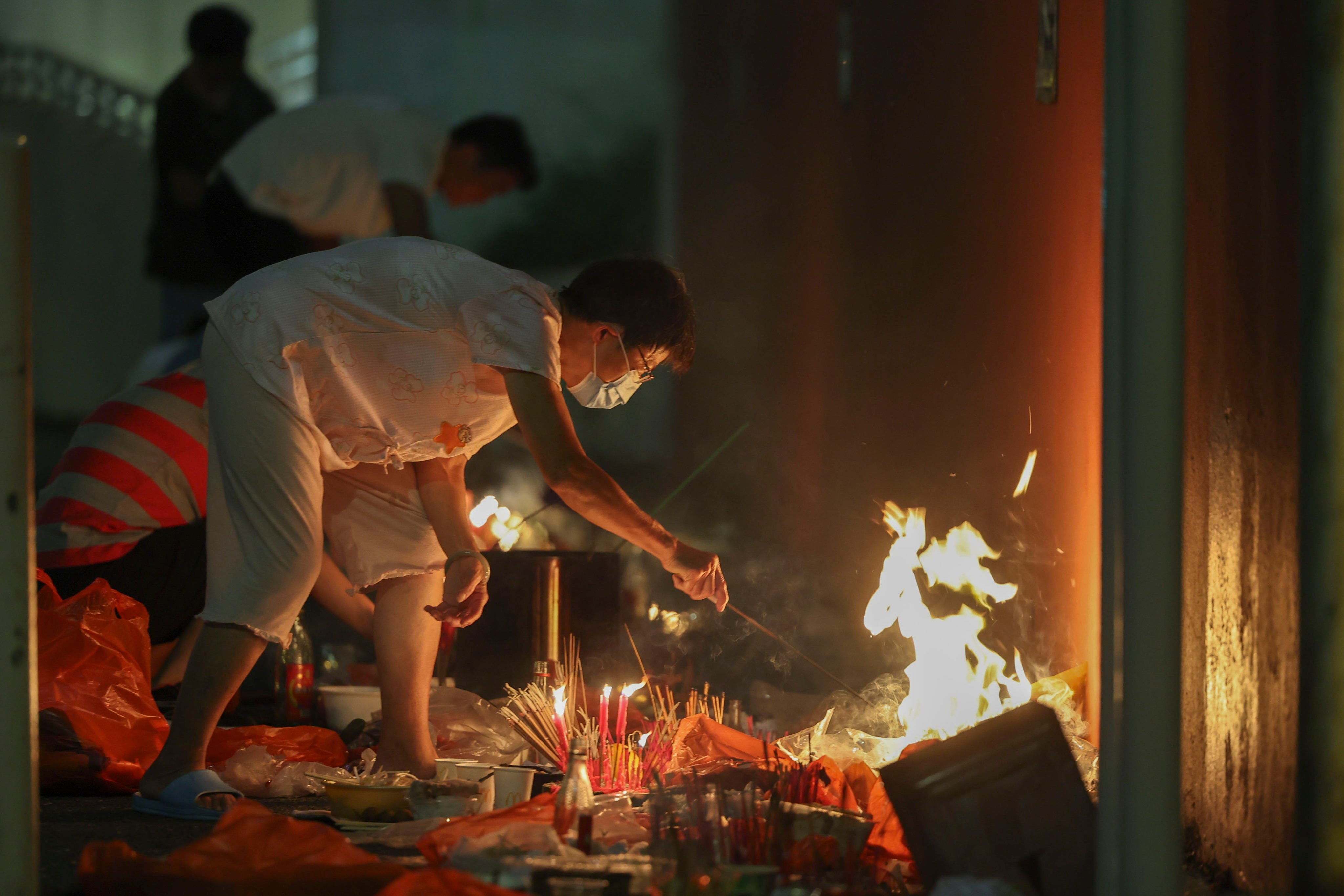 People burn joss money and offerings in Hong Kong during the 2024 Hungry Ghost Festival. Photo: Edmond So