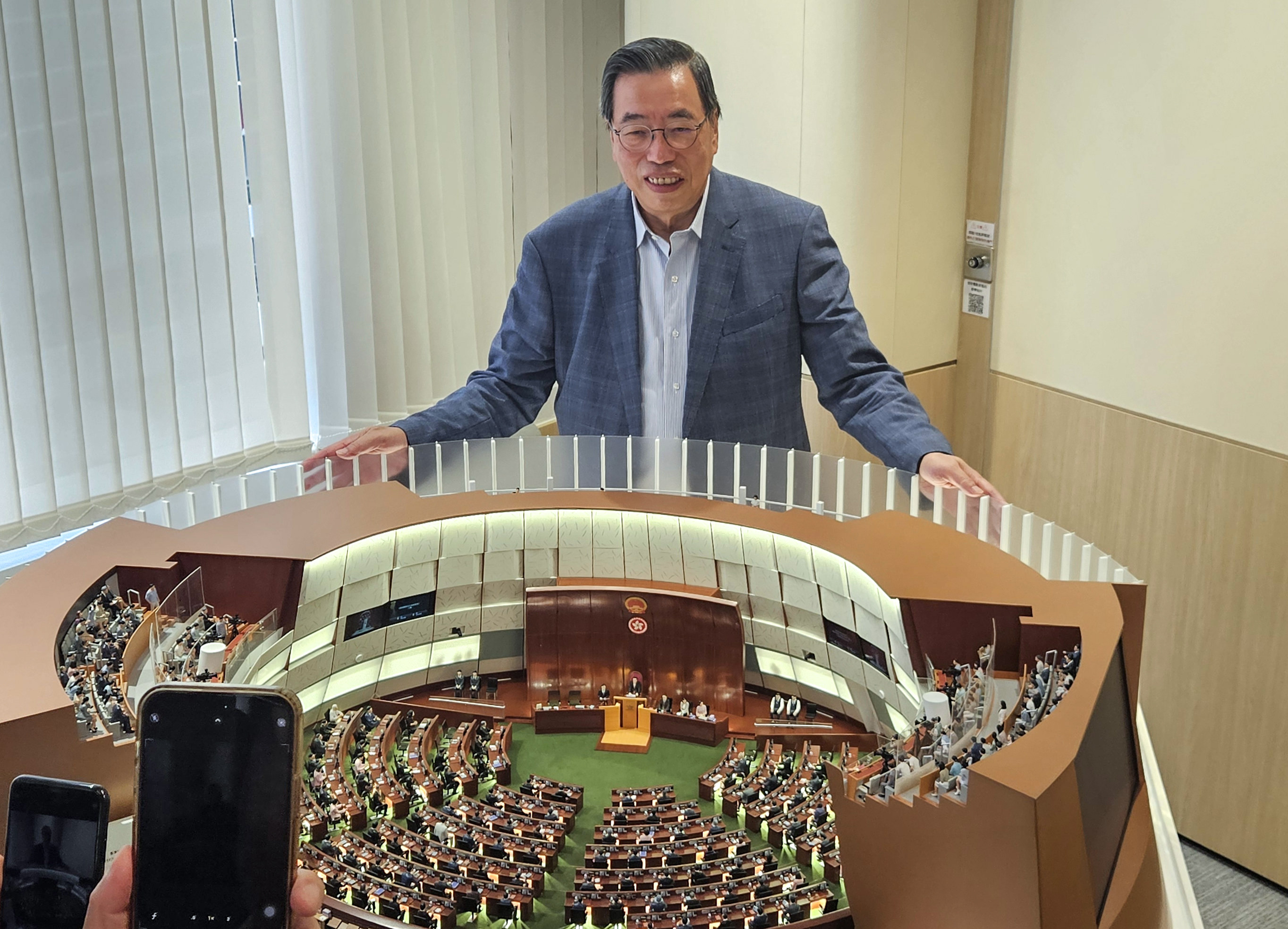Legco chairman Andrew Leung with the model of the chamber. Photo: Leopold Chen