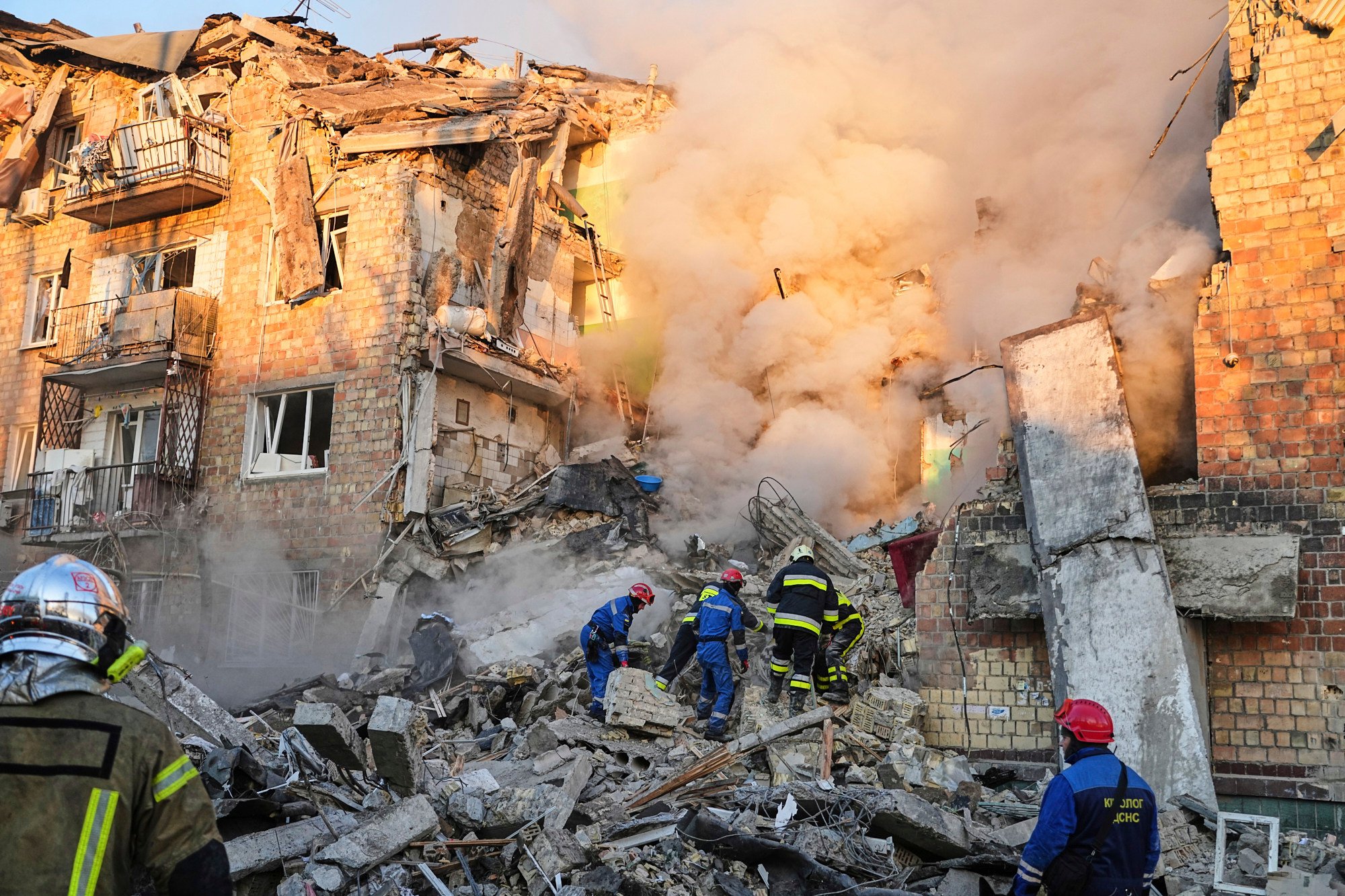 Firefighters work on the site of a burning building after a Russian attack in Kyiv, Ukraine, on Thursday. Photo: AP