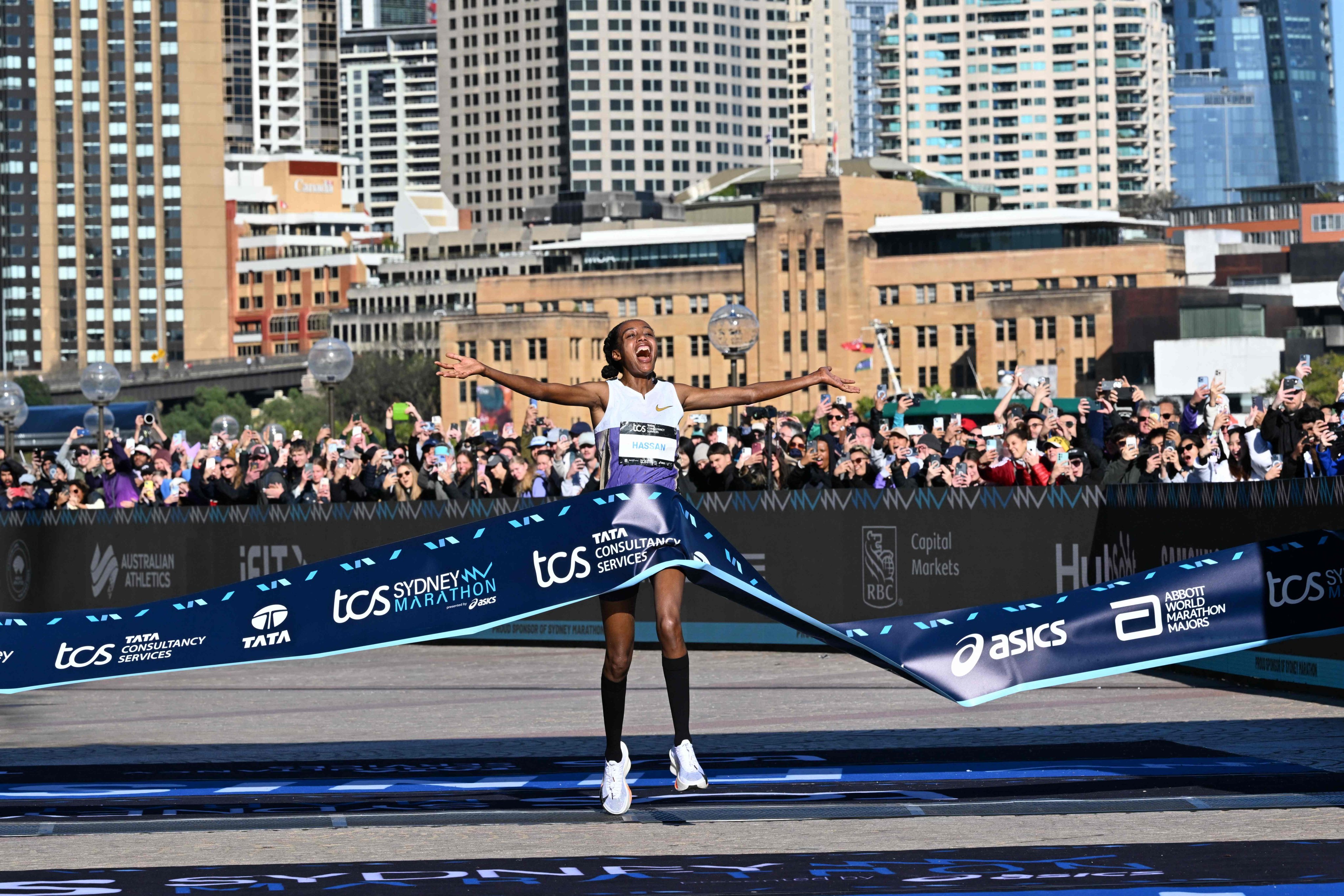 Netherlands’s Sifan Hassan celebrates as she crosses the finish line in the 2025 Sydney Marathon. Photo: AFP