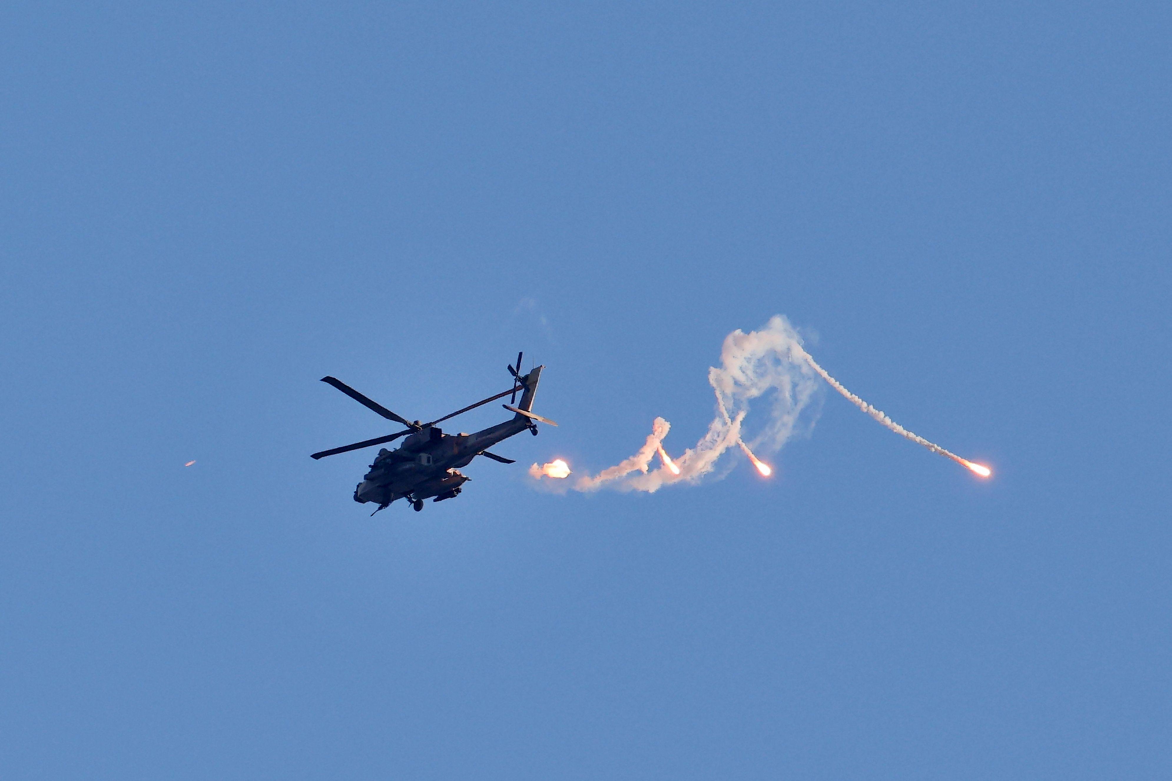 An Israeli Apache helicopter releasing flares over Gaza on Friday. Photo: AFP