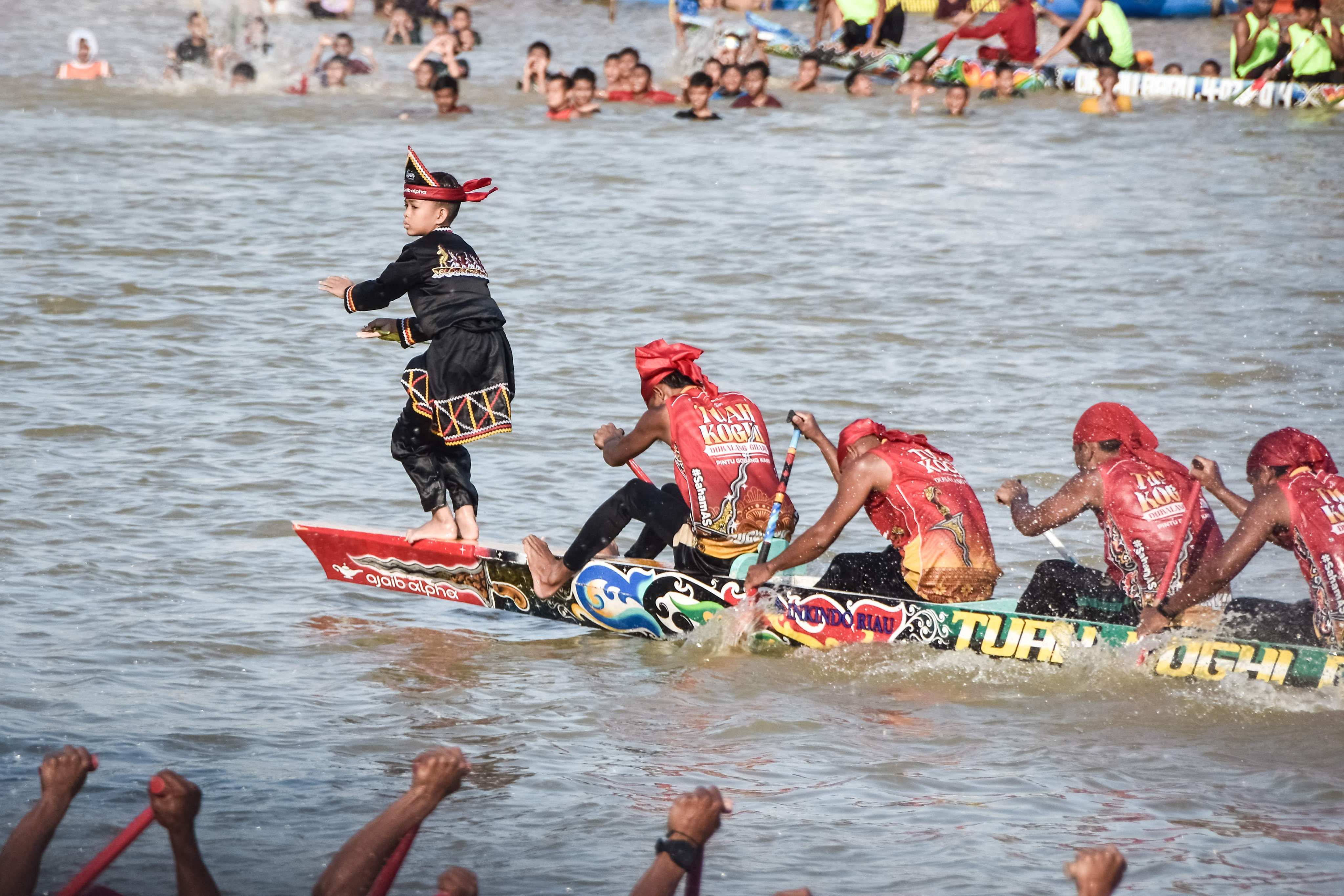 Rayyan Arkan Dikha, 11, dances on the bow of his team’s longboat during the Pacu Jalur river race in Sumatra’s Riau Province. Attendance at this year’s event, which dates back to the 17th century, is estimated to have swelled by more than 100,000 after a video of the boy’s moves garnered millions of views on social media. Photo: AFP