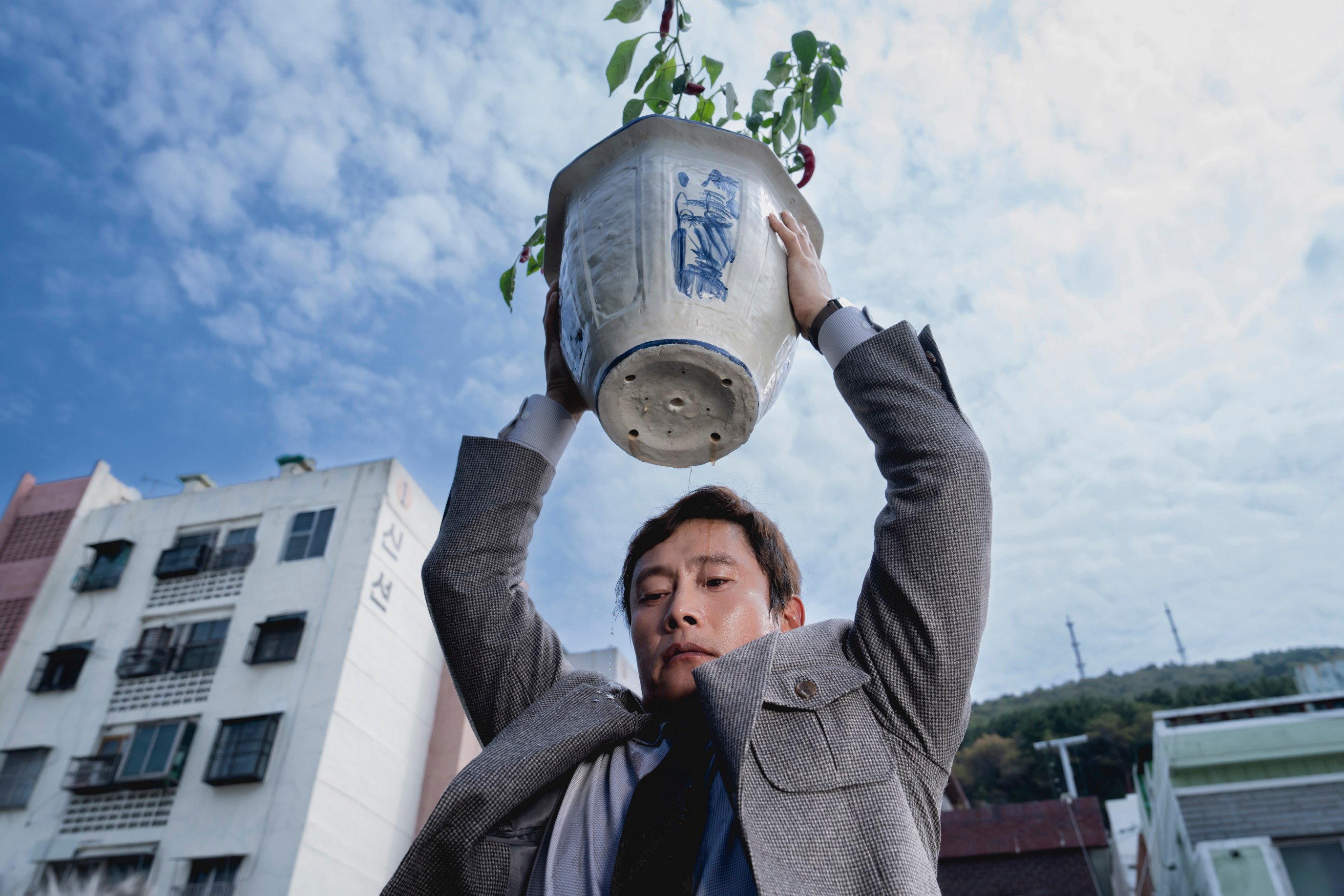 Lee Byung-hun as a desperate jobseeker in a still from No Other Choice, directed by Park Chan-wook. Son Ye-jin and Park Hee-soon co-star.