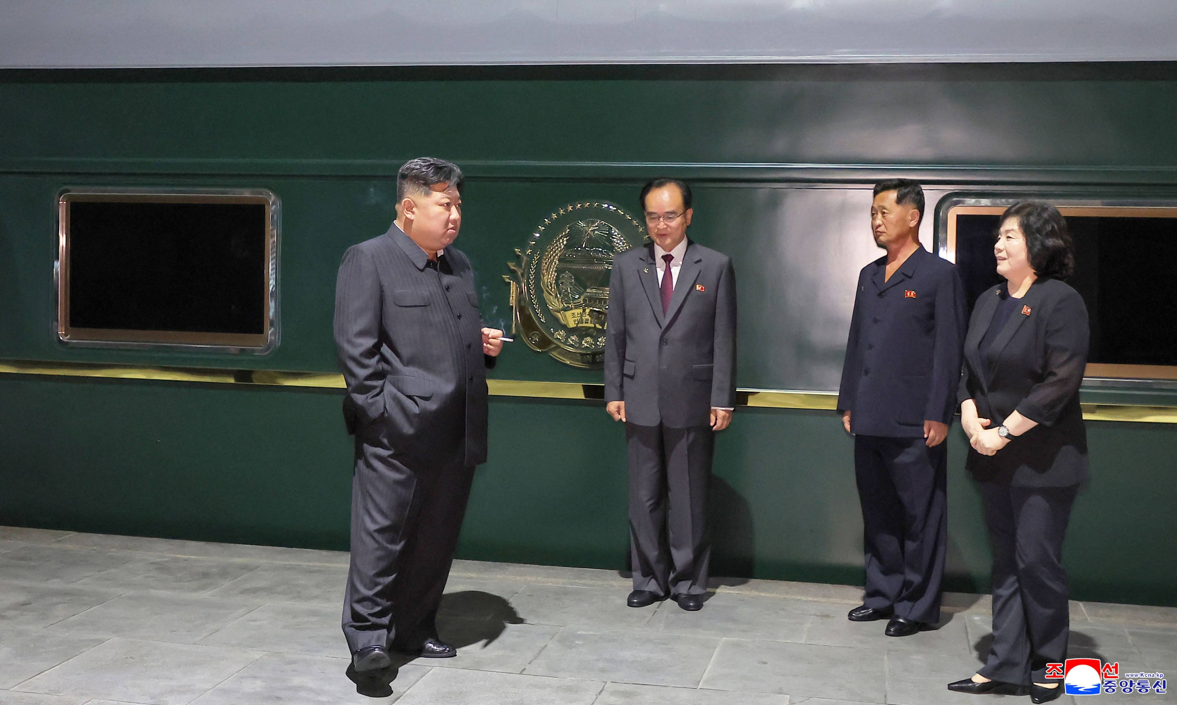North Korea’s leader Kim Jong-un (left) departs from Pyongyang by special train to visit Beijing on Monday. Photo: KCNA/AFP
