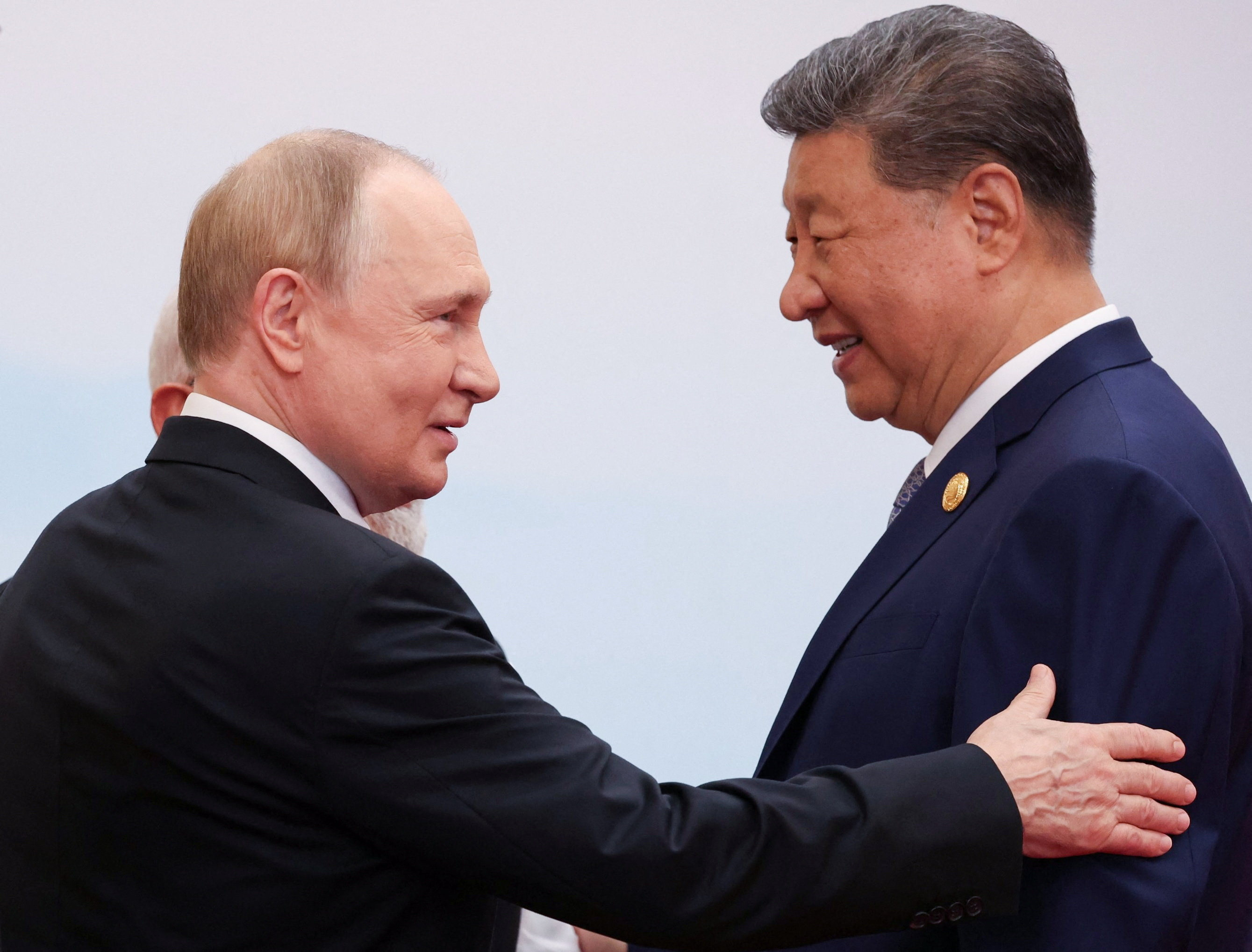 Russian President Vladimir Putin and President Xi Jinping speak at the Shanghai Cooperation Organisation summit in Tianjin, China, on Monday. Photo: Reuters