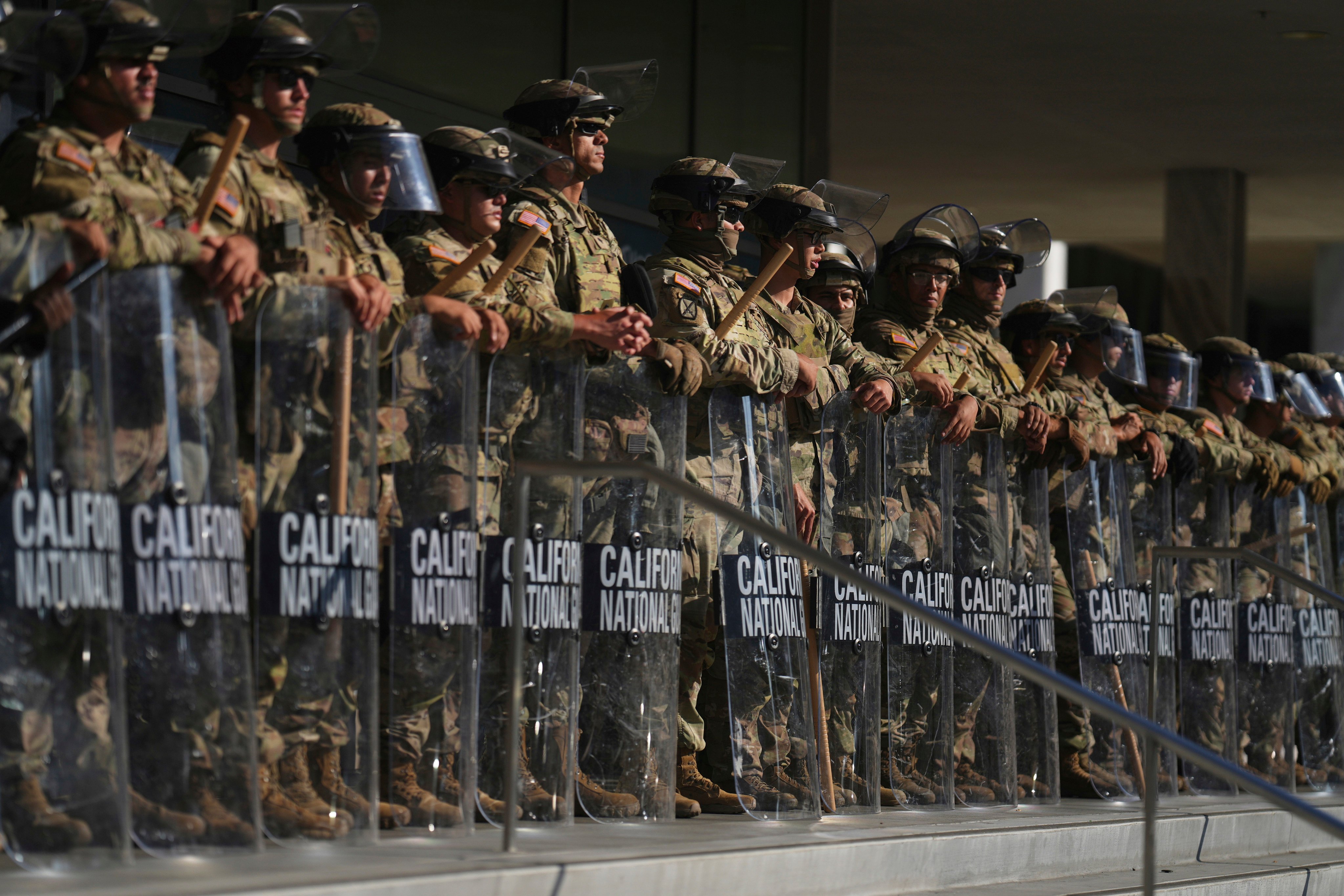 California National Guard members are positioned at the Federal Building in downtown Los Angeles in June. Photo: AP