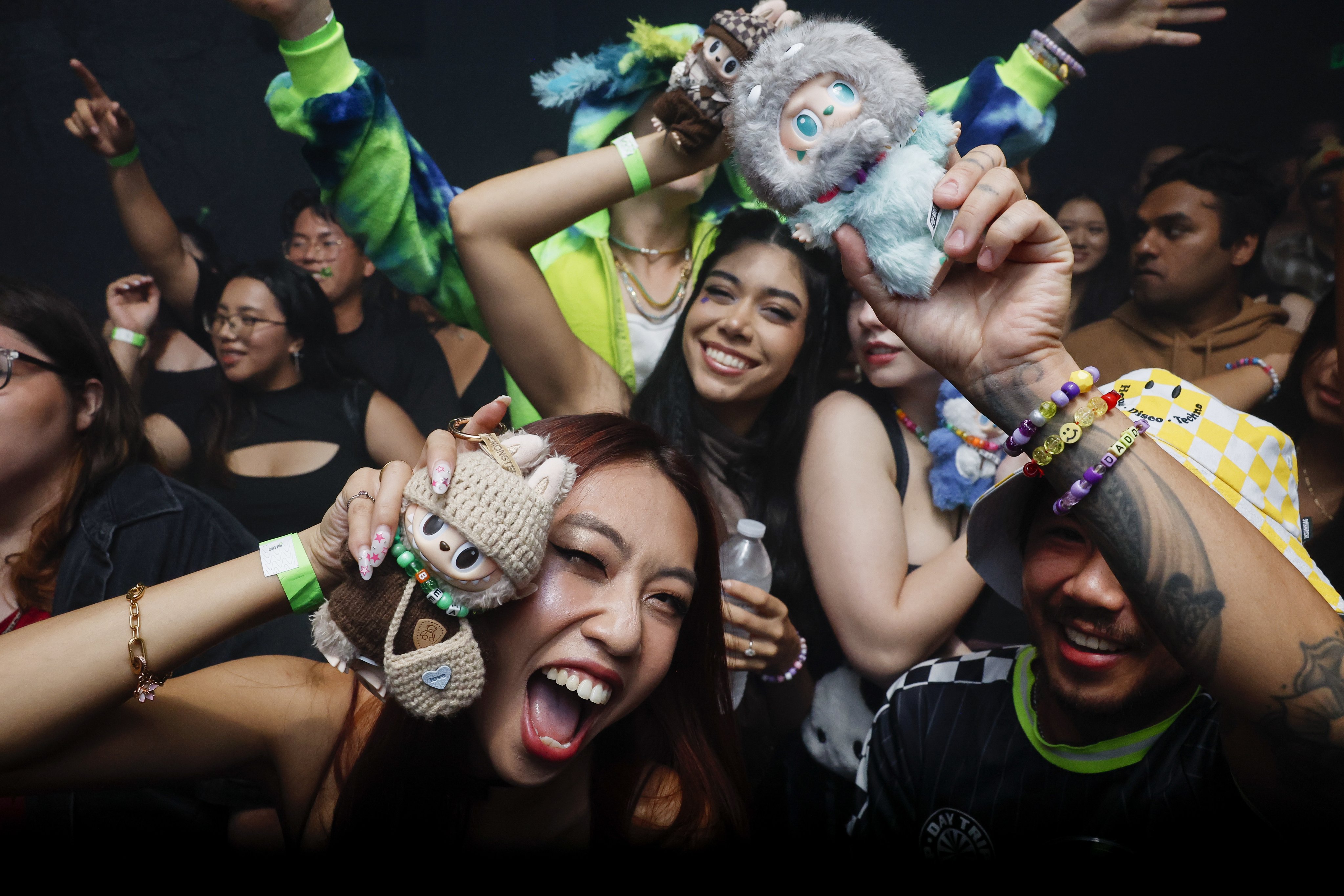 People pose with their dolls during a Labubu-themed rave at Catch One nightclub in Los Angeles on August 30. Photo: EPA