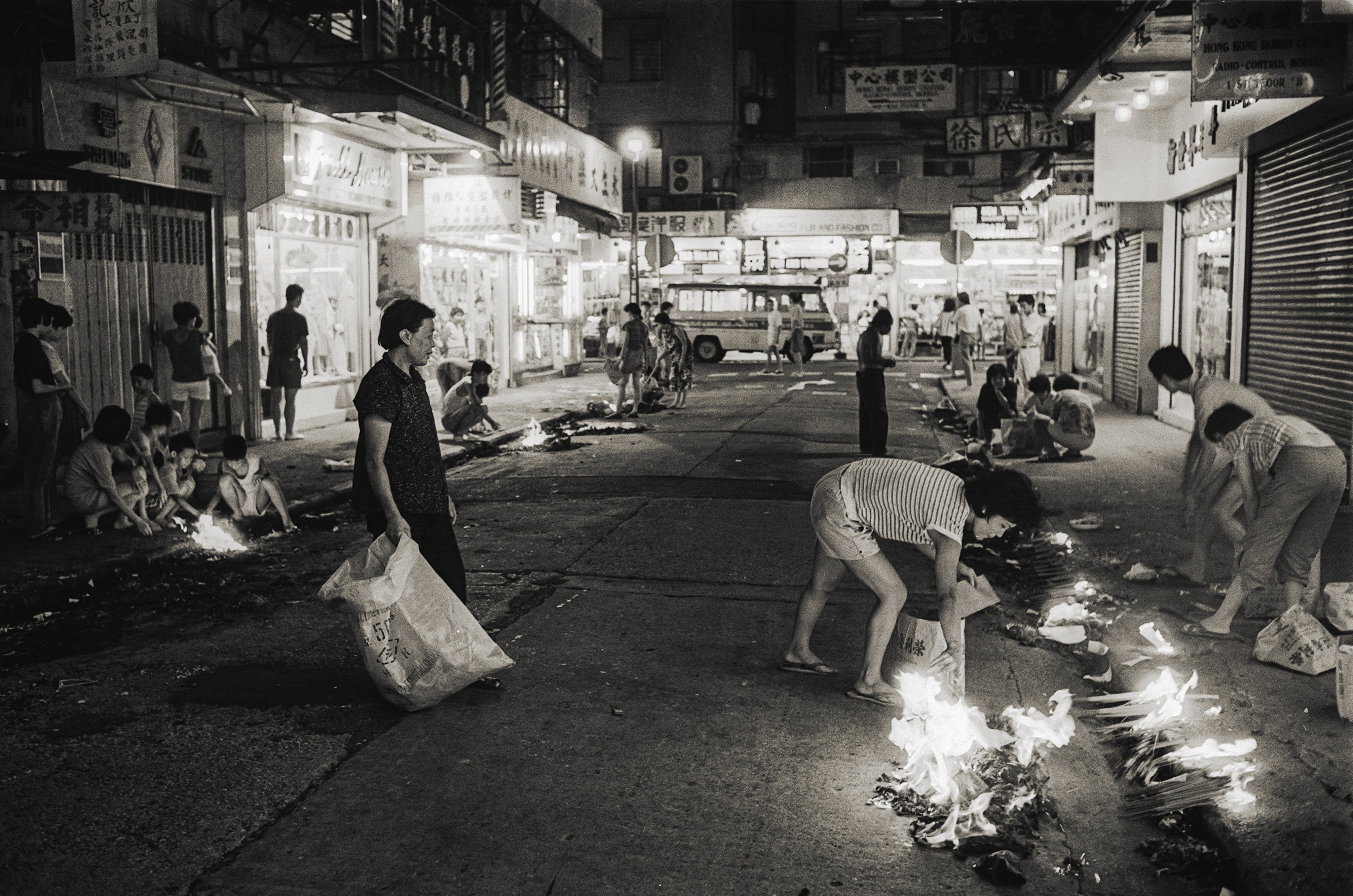 People burning paper offerings and incense on the street to appease the spirits during the Hungry Ghosts Festival in Hong Kong, in 1986. Photo: SCMP Archives