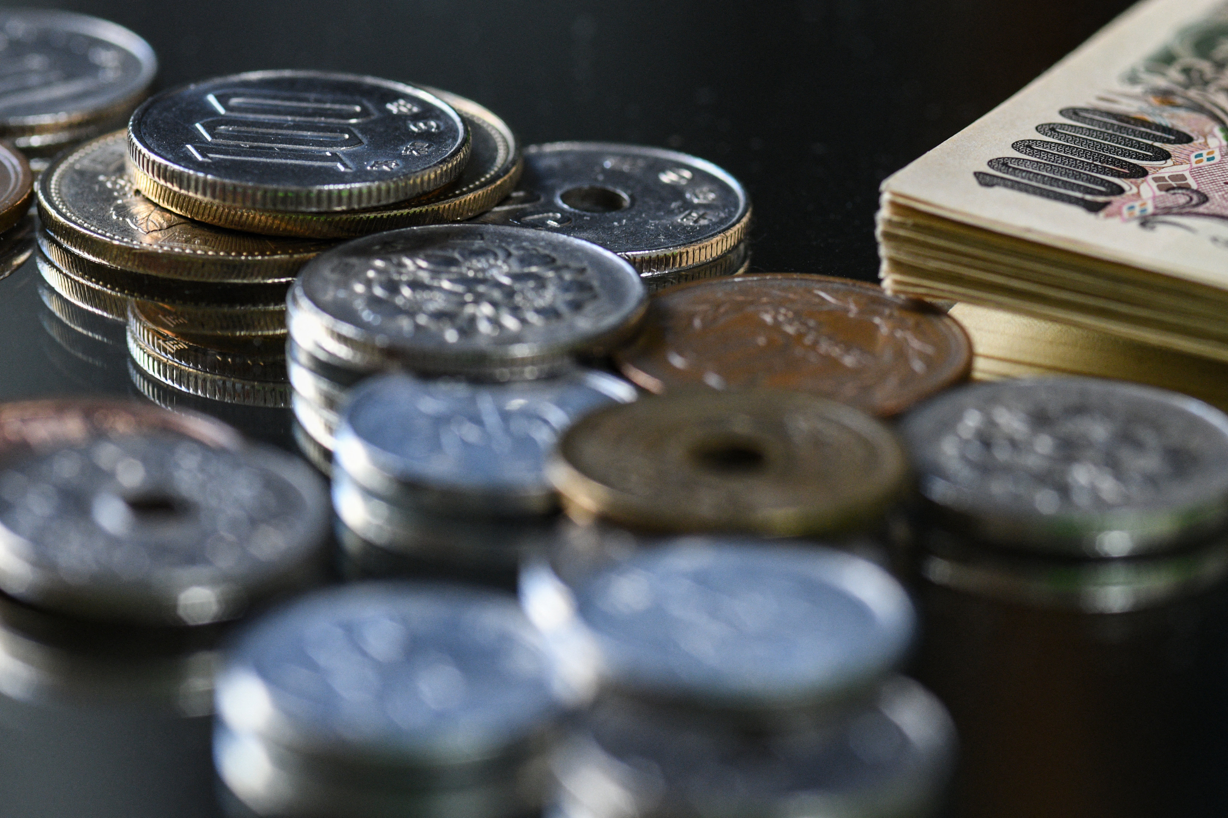 Japanese yen coins. Some restaurants in Japan have started installing “tip boxes”. Photo: AFP