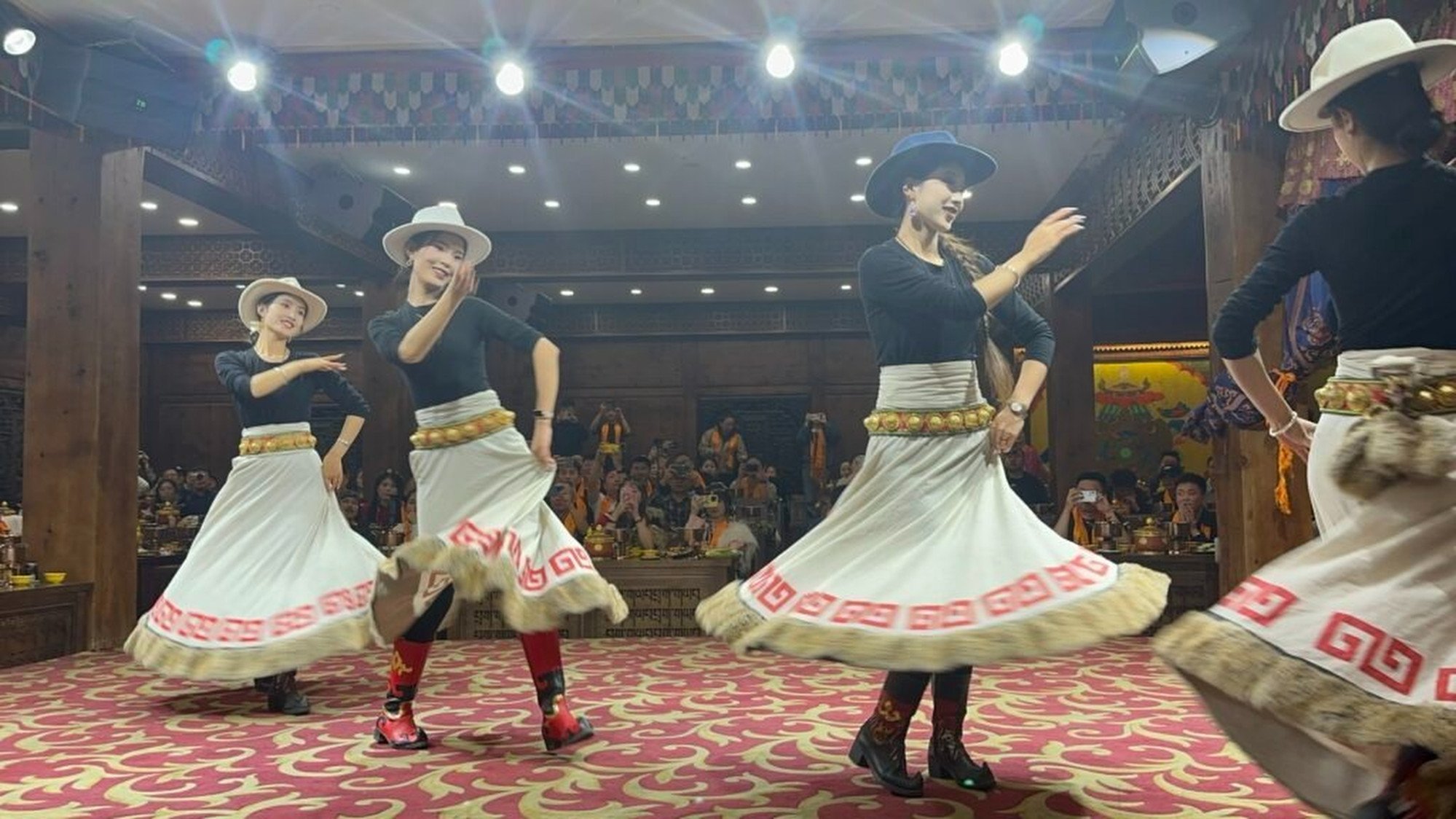 Tourist draw Yongzong sings and dances on stage at a Shangri-La restaurant. Photo: Handout