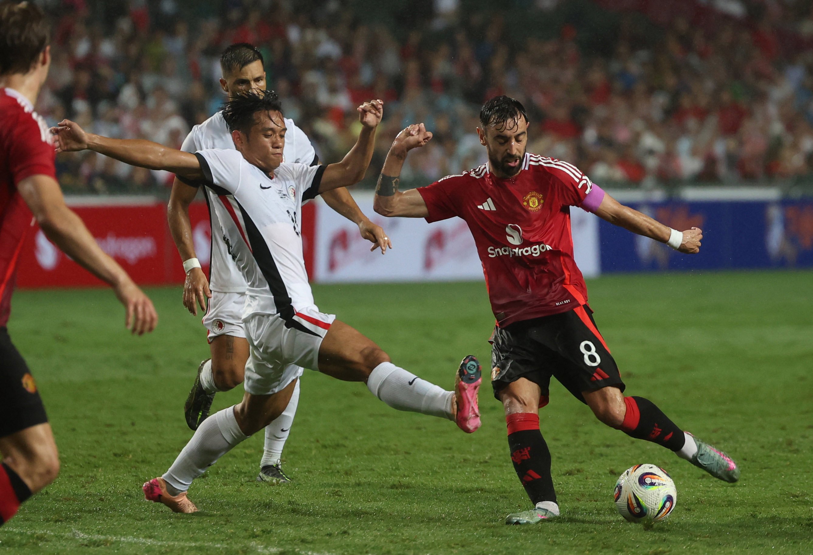 Ngan Cheuk-pan rushes to block Bruno Fernandes’ shot in Hong Kong’s friendly against Manchester United in May. Photo: Reuters
