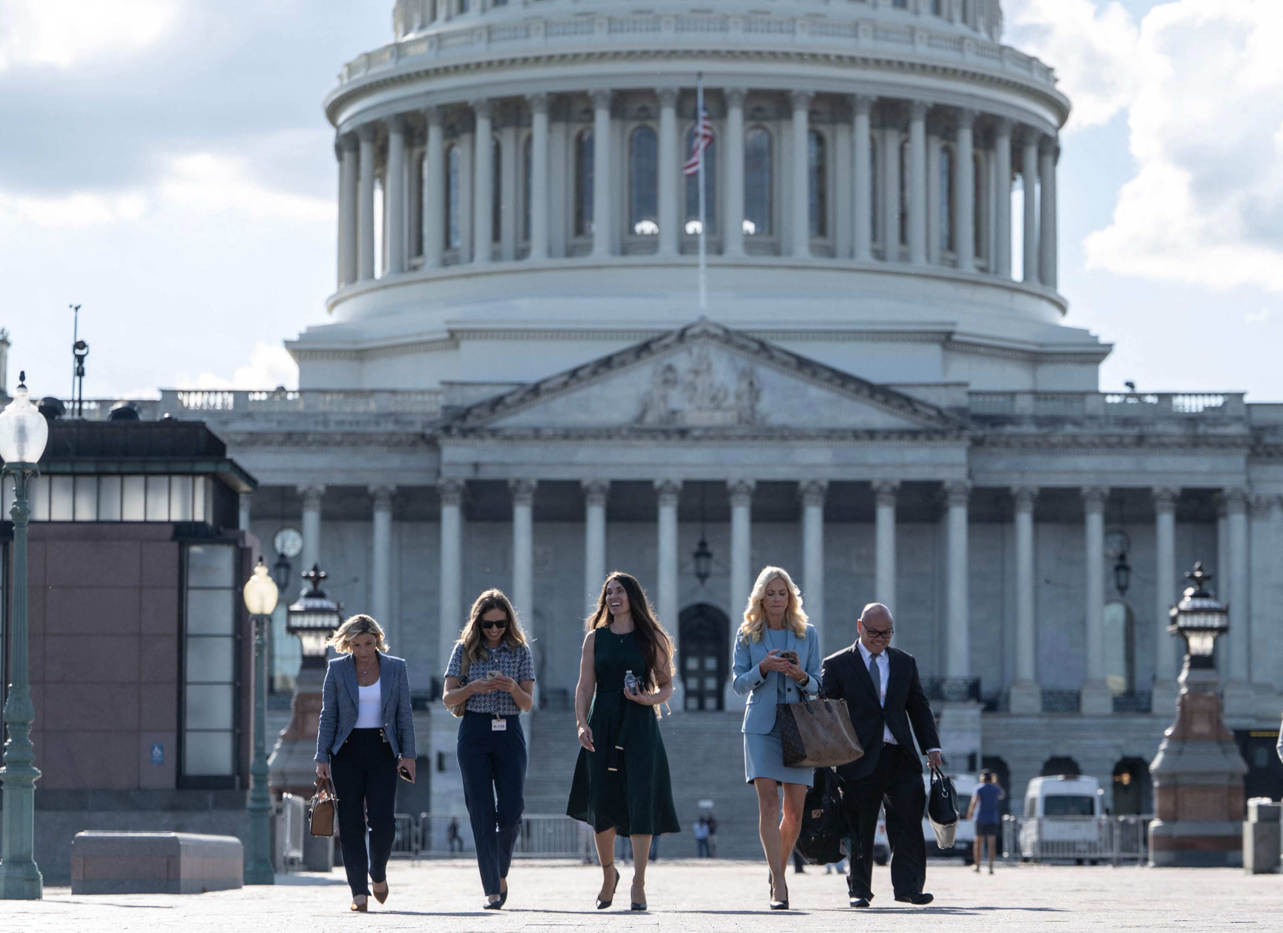 Theresa Helm (centre), an abuse victim of Jeffery Epstein, walks with a group of women after they spoke behind closed doors with the House Oversight Committee at the US Capitol in Washington on Tuesday. Photo: AFP