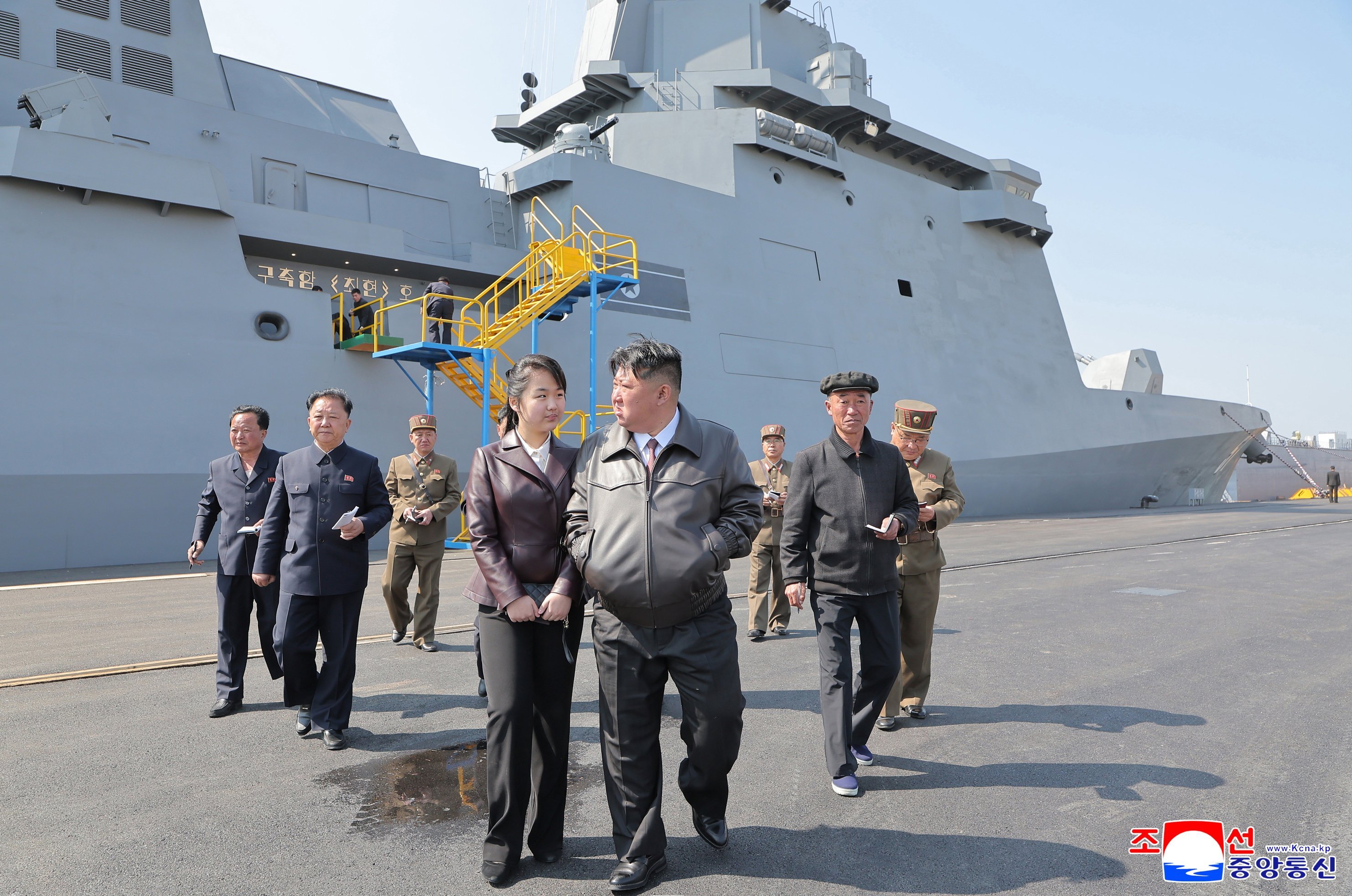 North Korean leader Kim Jong-un and daughter Kim Ju-ae attending the first test firing on the destroyer Choe Hyon at an undisclosed location in North Korea in April. Photo:  EPA-EFE