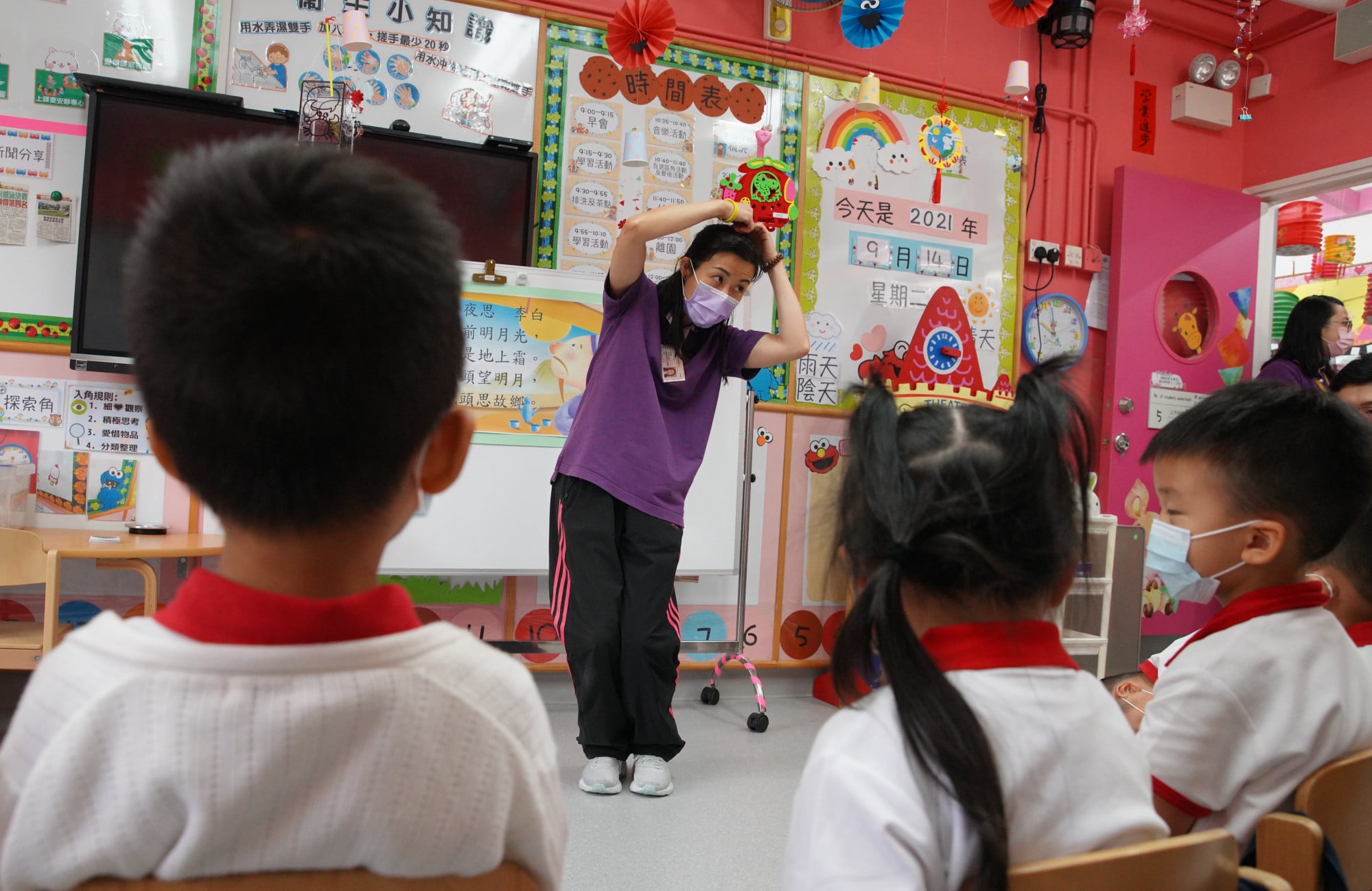 A teacher conducts a lesson at a kindergarten in Hong Kong. Photo: Winson Wong
