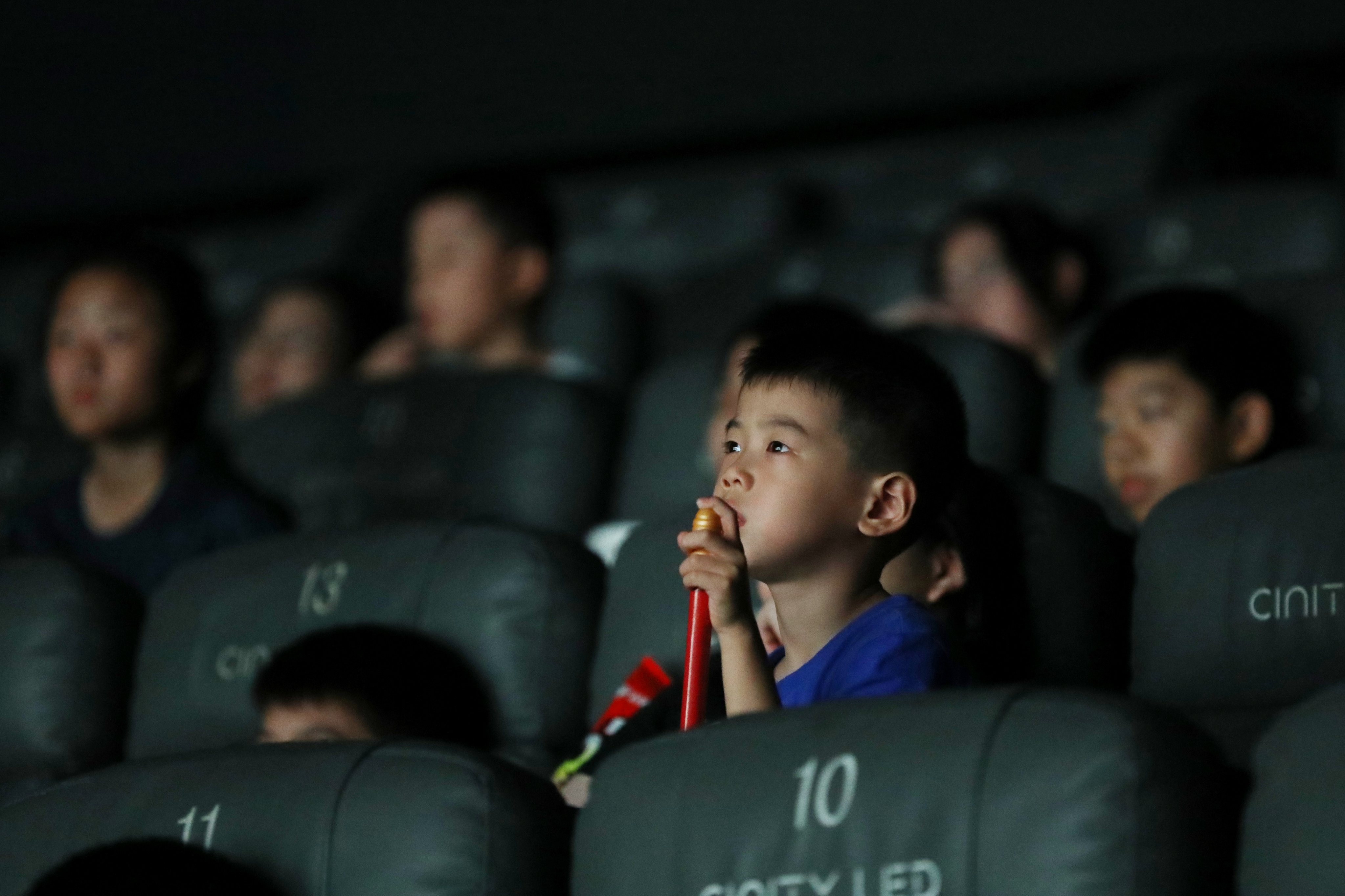 People watch a film at a cinema in Jiaxing, Zhejiang province, on August 17. Photo: Xinhua