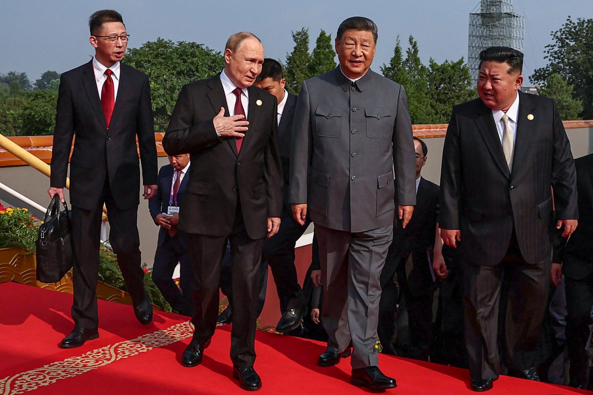 Chinese President Xi Jinping (centre) walks with Russian leader Vladimir Putin and North Korean leader Kim Jong-un before the parade on Wednesday. Photo: AFP Chinese President Xi Jinping (centre) walks with Russian leader Vladimir Putin and North Korean leader Kim Jong-un before the parade on Wednesday. Photo: AFP
