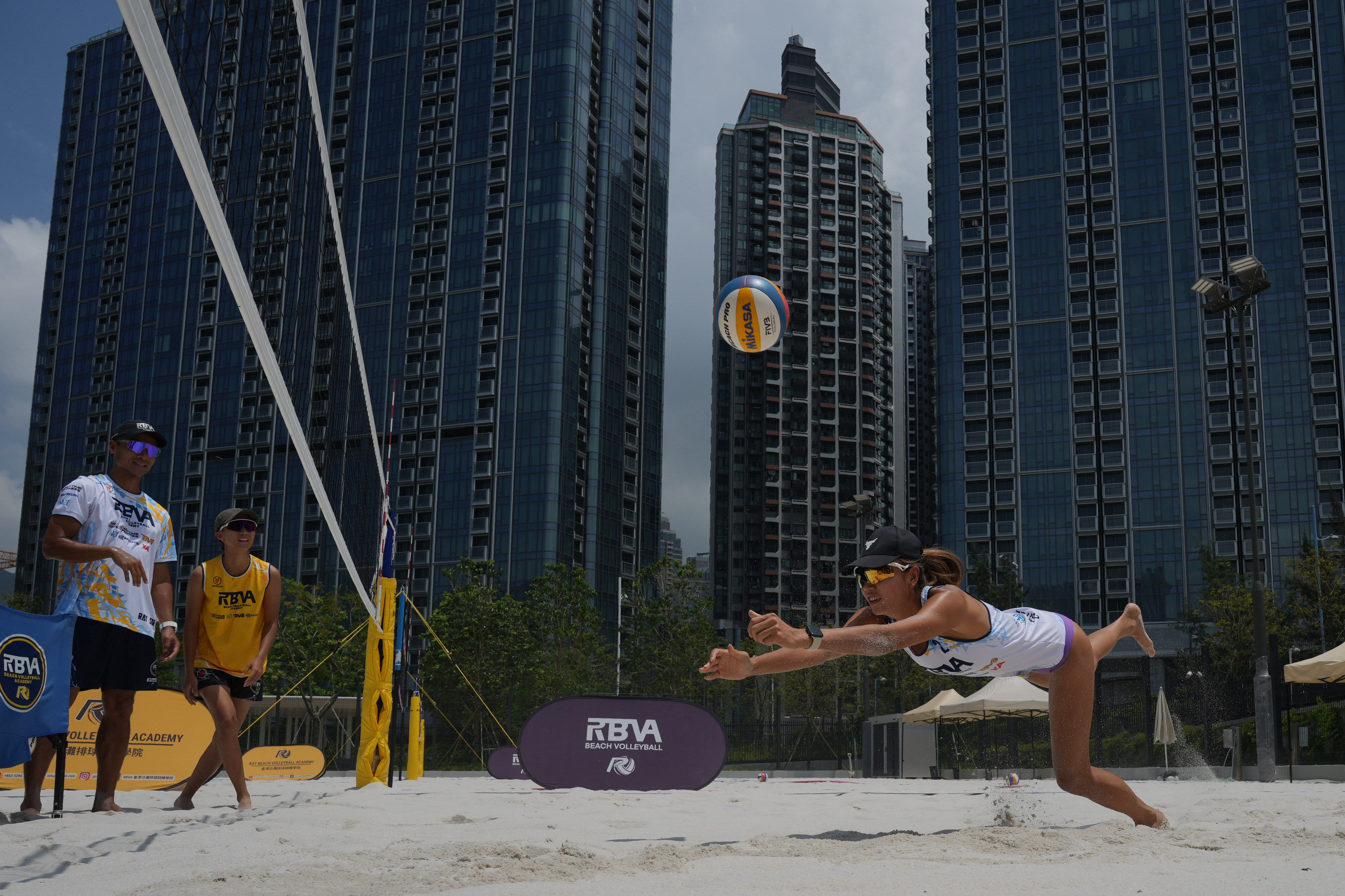 The Hong Kong beach volleyball team demonstrate their skills on a new court at Kai Tak Sports Park. Photo: May Tse