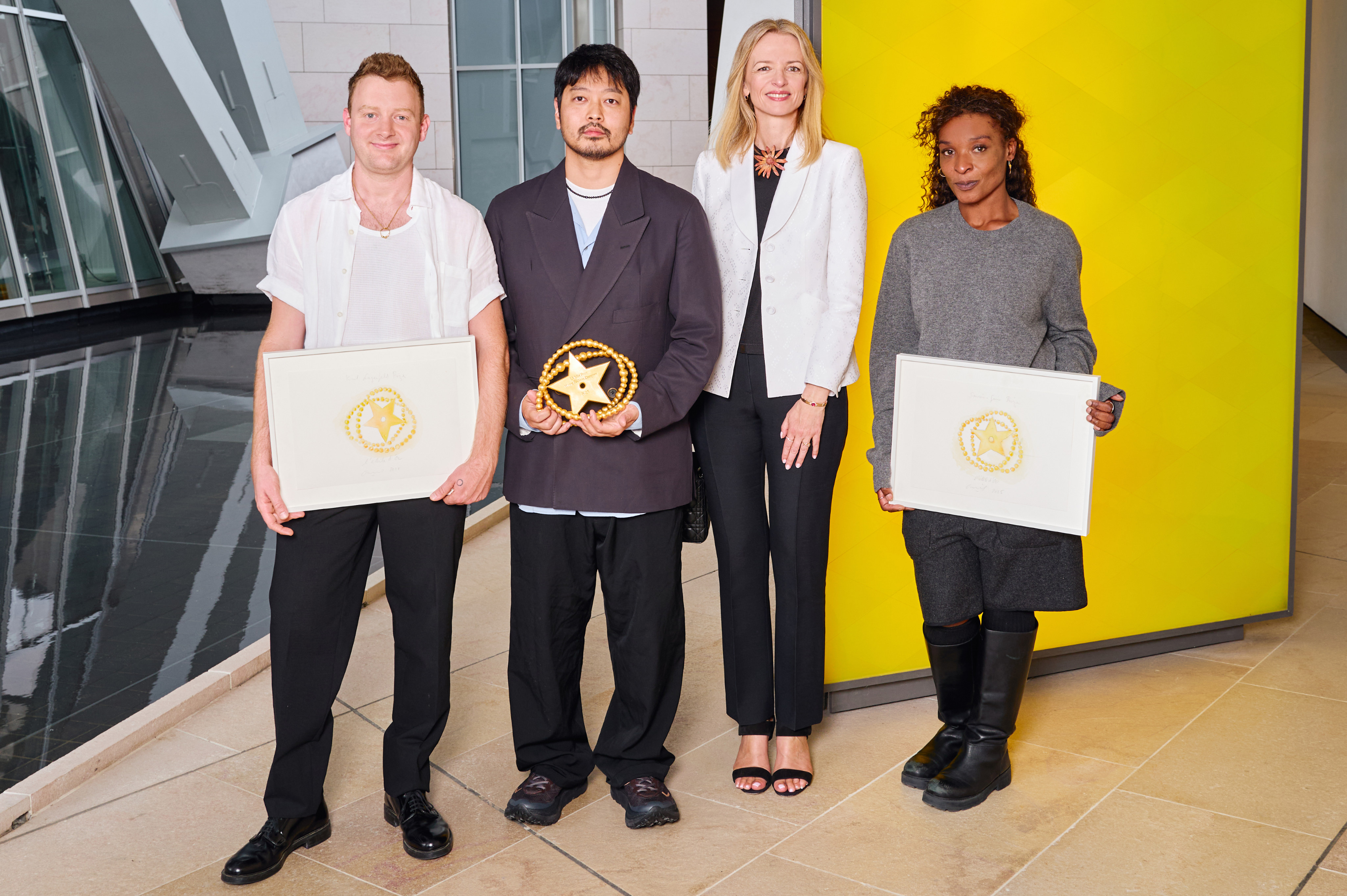 Founder of the LVMH Prize, Delphine Arnault (second from right), poses with Soshi Otsuki (second from left), who won the LVMH Prize, while Steve O Smith (left) and Torishéju Dumi (right) took home the the Karl Lagerfeld Prize and Savoir-Faire Prize, respectively. Photo: Handout