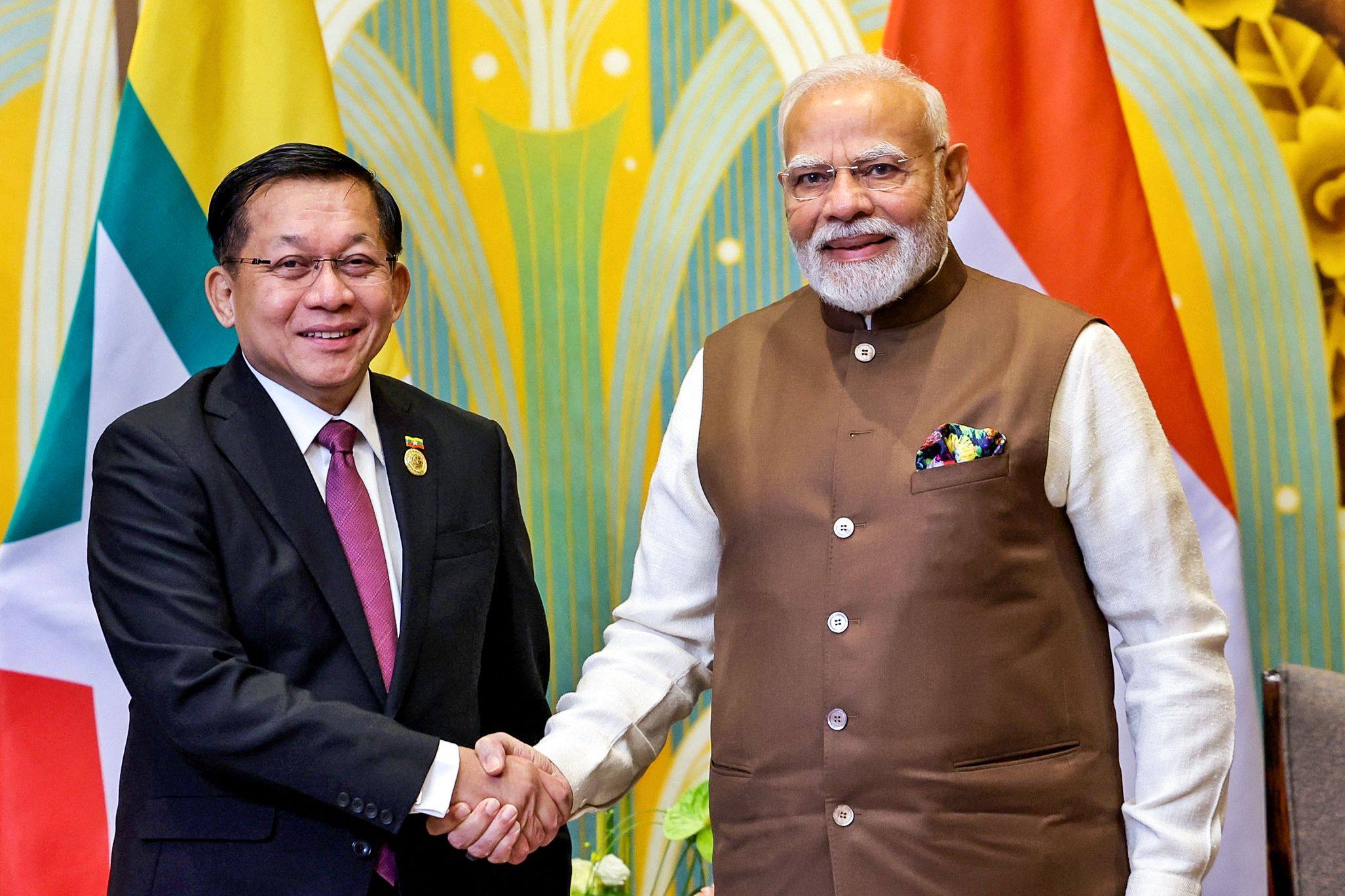 India’s Prime Minister Narendra Modi shakes hands with Myanmar’s junta chief Min Aung Hlaing (left) on the sidelines of the Shanghai Cooperation Organisation summit in Tianjin on August 31. Photo: by Indian Press Information Bureau / AFP