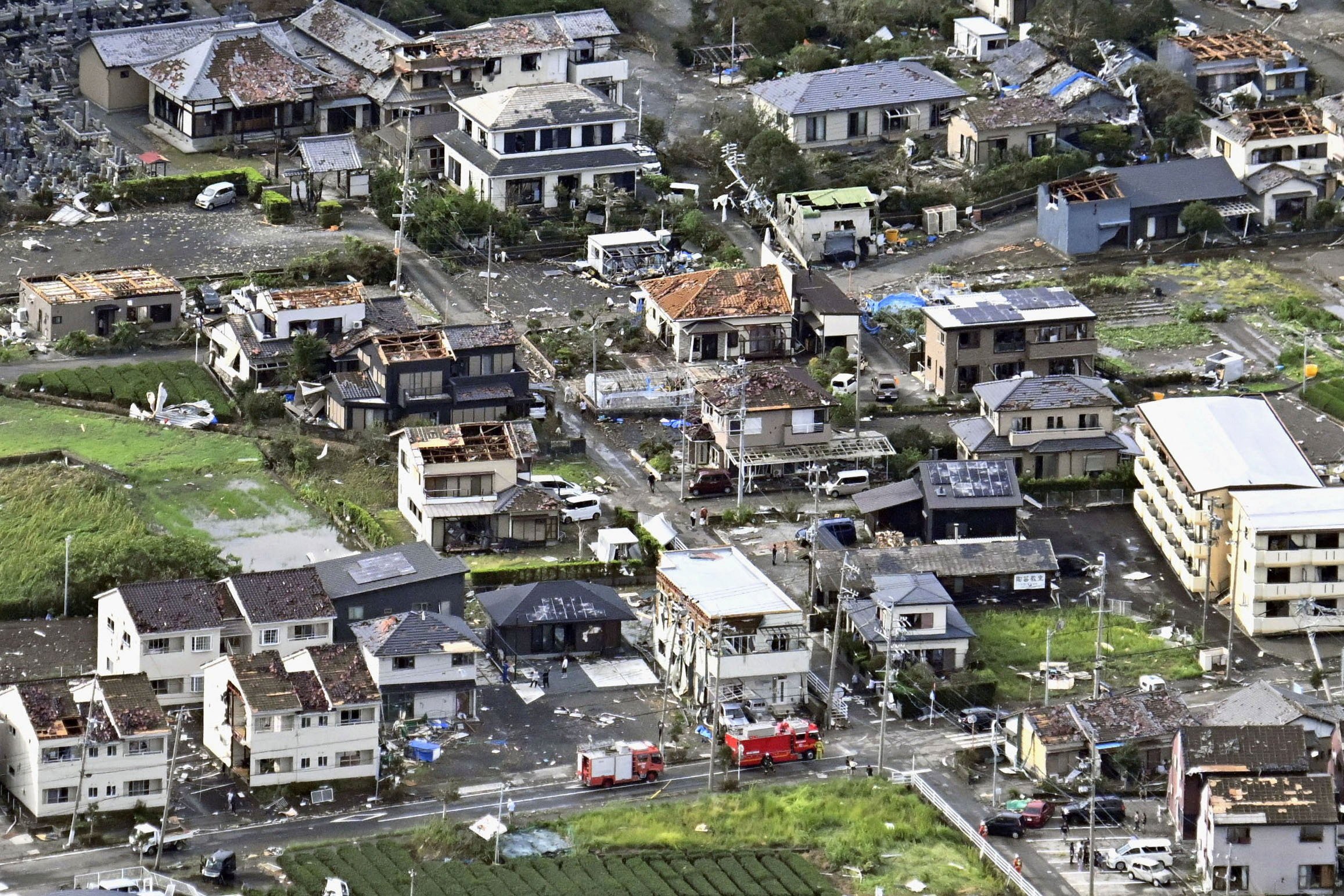 Roofs and exterior walls of residential houses, torn off following an apparent tornado, lie scattered as a typhoon hits wide areas of Japan, in Makinohara, Shizuoka prefecture, on Friday. Photo: Kyodo via Reuters