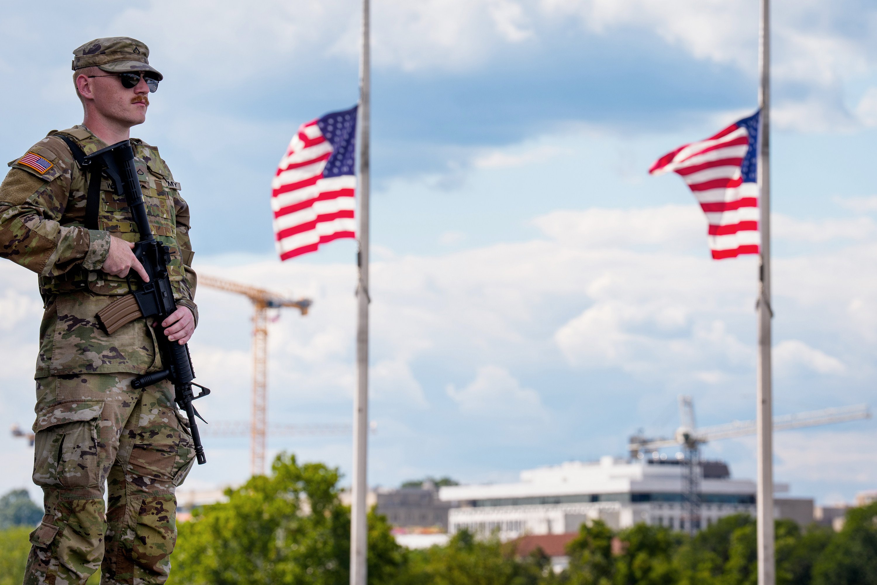 An armed member of the National Guard stands at the base of the Washington Monument in Washington on August 27. Photo: Getty Images via TNS