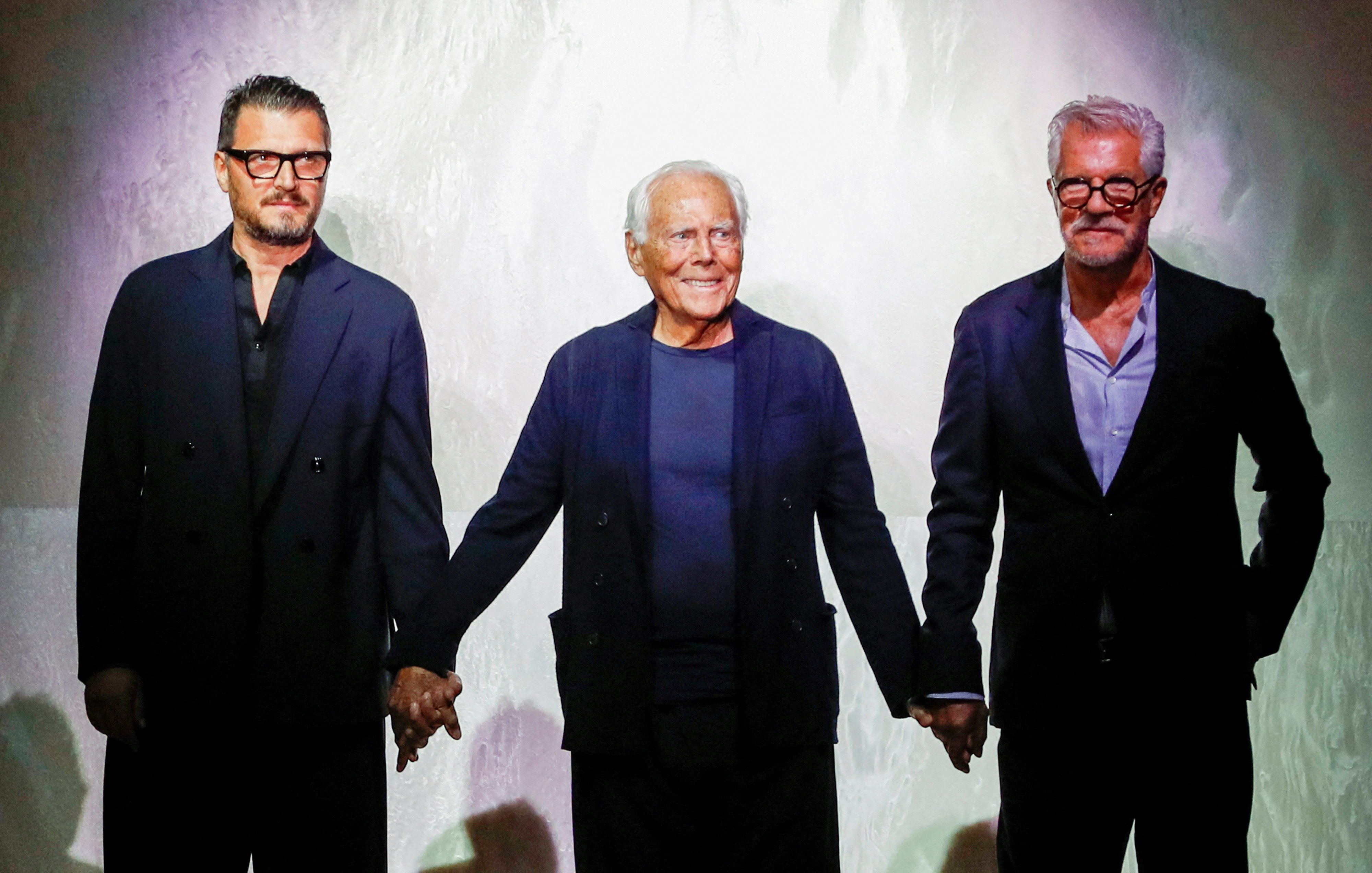 Giorgio Armani (centre) with Armani execs Leo Dell’Orco (right) and Gianluca Dell’Orco (left) at Milan Fashion Week in 2024. Photo: Reuters