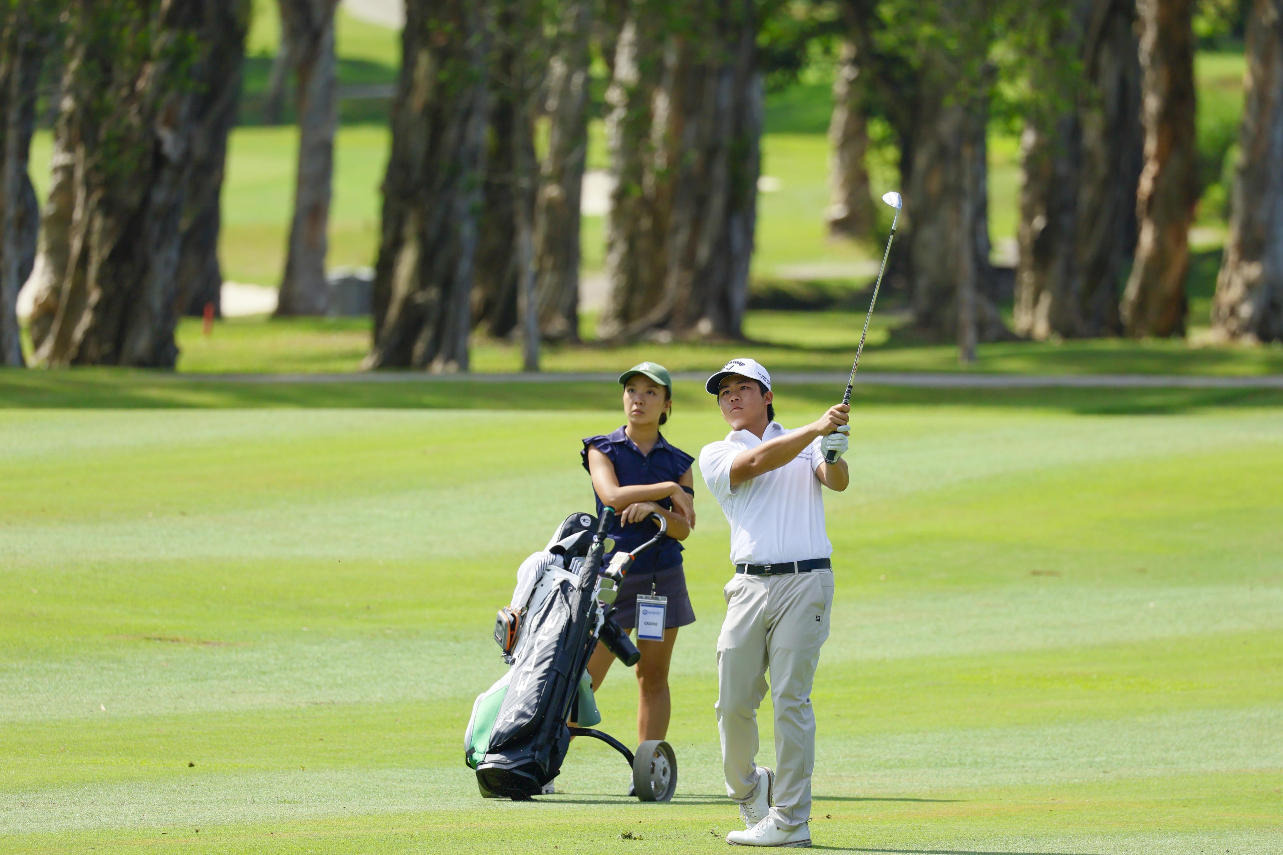 Isaac Lam plays an approach shot during the first round of the Link Hong Kong Open qualifier at Hong Kong Golf Club. Photo: HKGC