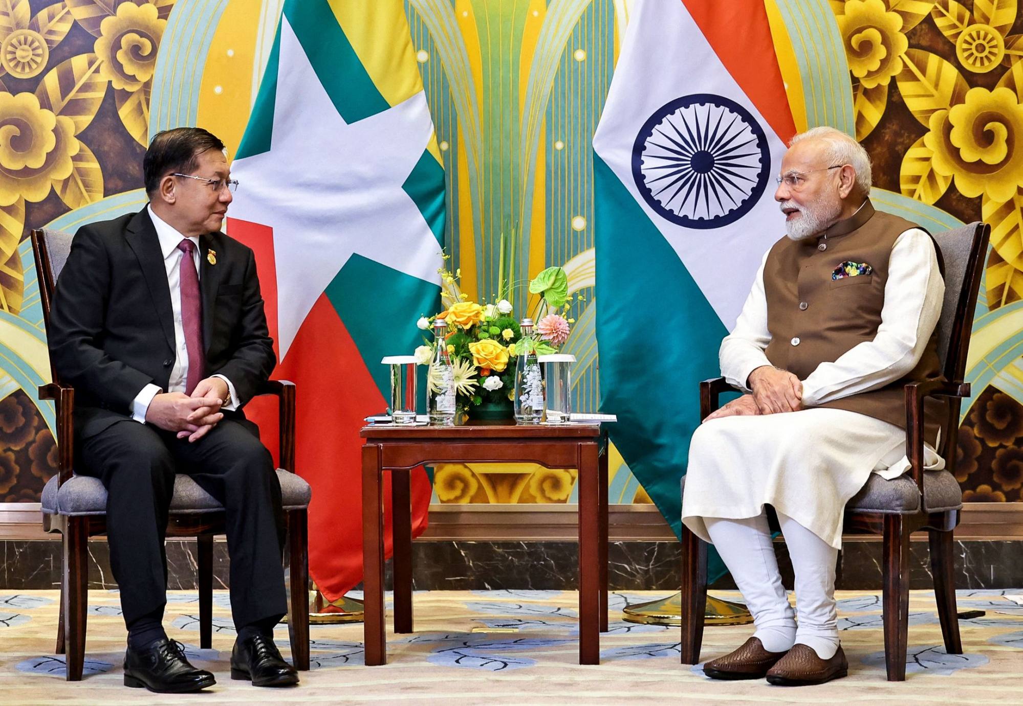 Modi speaks with Myanmar’s junta chief during their bilateral meeting on August 31. Photo: Indian Press Information Bureau / AFP