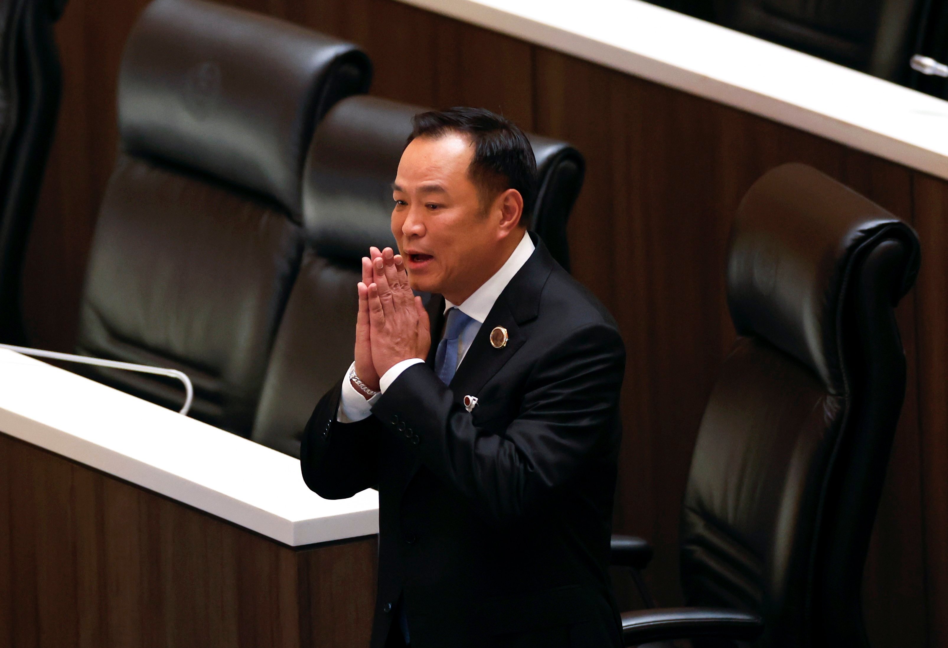 Anutin Charnvirakul greets lawmakers at parliament in Bangkok on Friday. Photo: EPA