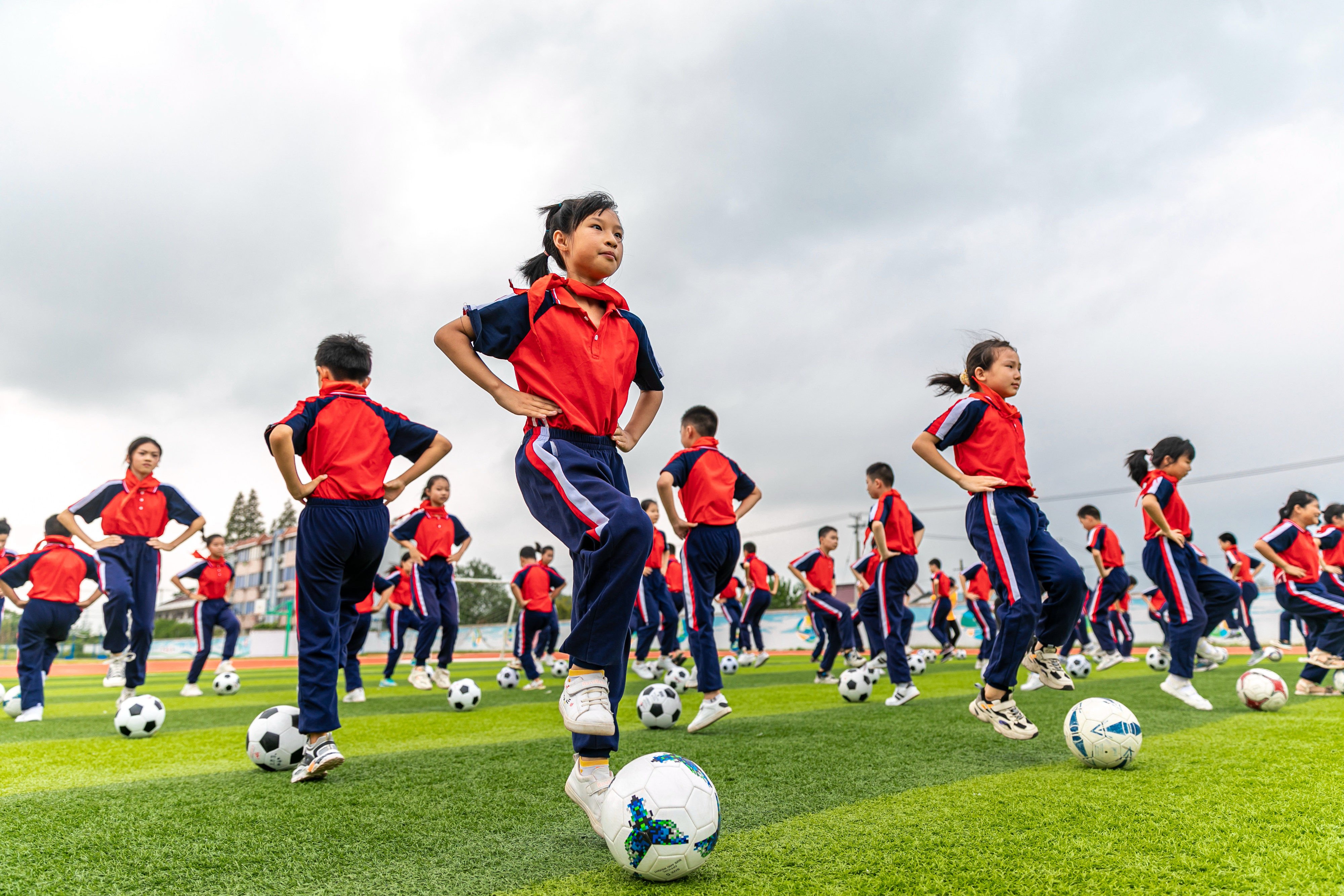 Students practice football skills at a primary school in Nantong, Jiangsu province, in 2021. Photo: Getty Images