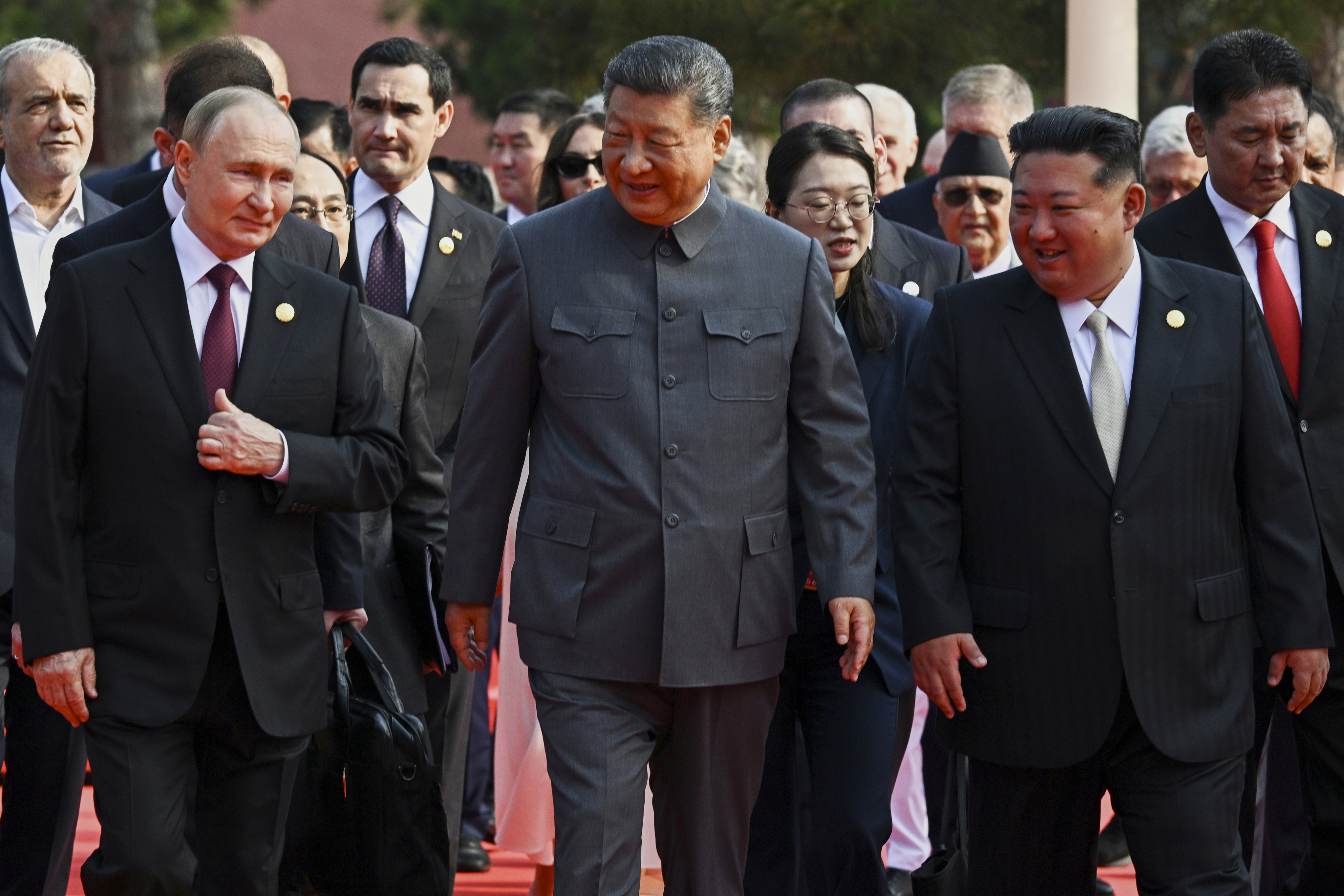 Chinese President Xi Jinping is flanked by Russian President Vladimir Putin and Kim Jong-un (right), in a multilateral debut for the North Korean leader in Beijing on Wednesday. Photo: AP