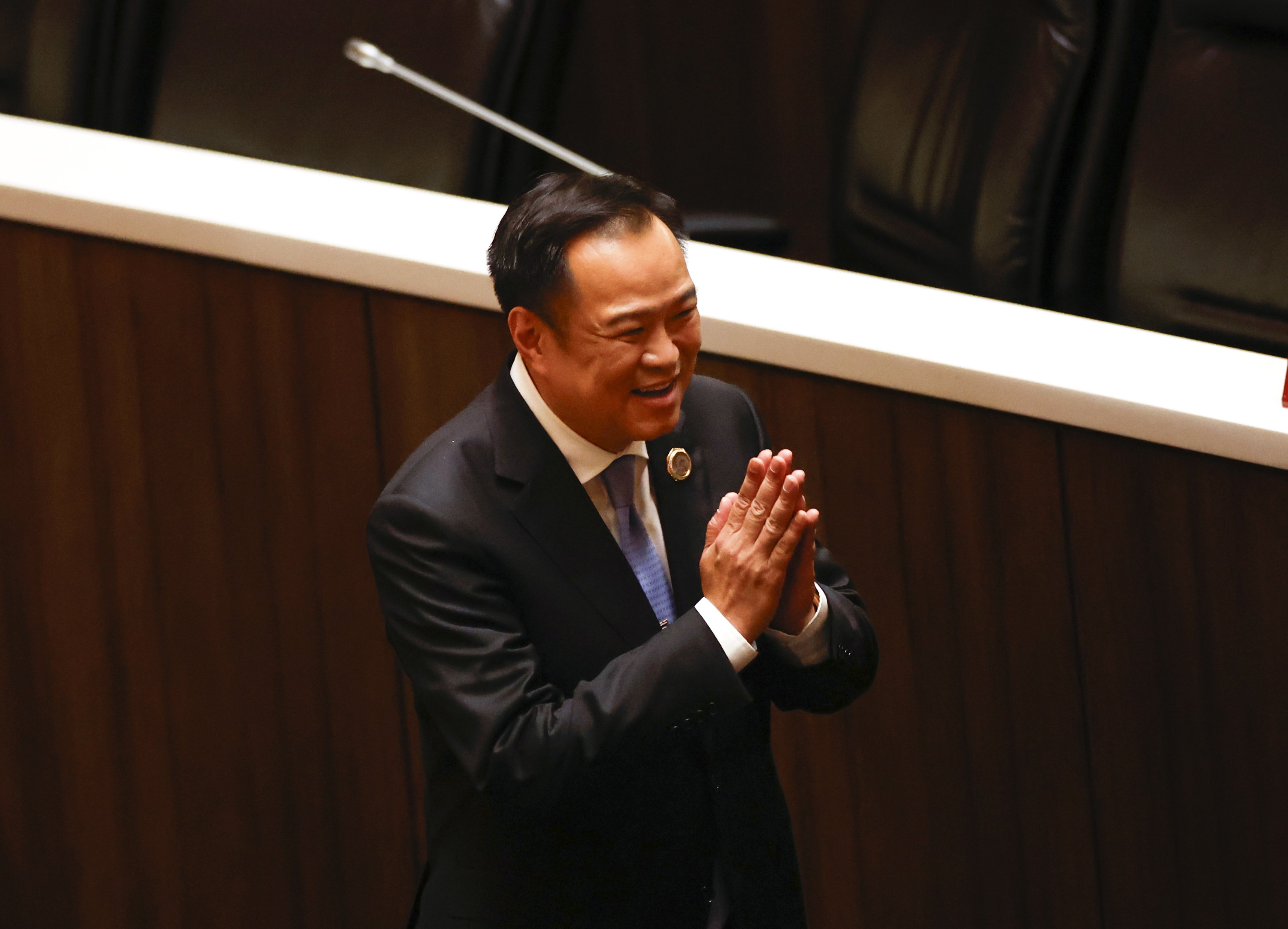 Anutin Charnvirakul performs a traditional greeting to thank lawmakers after being elected as prime minister during a voting session at parliament in Bangkok, Thailand, on Saturday. Photo: EPA