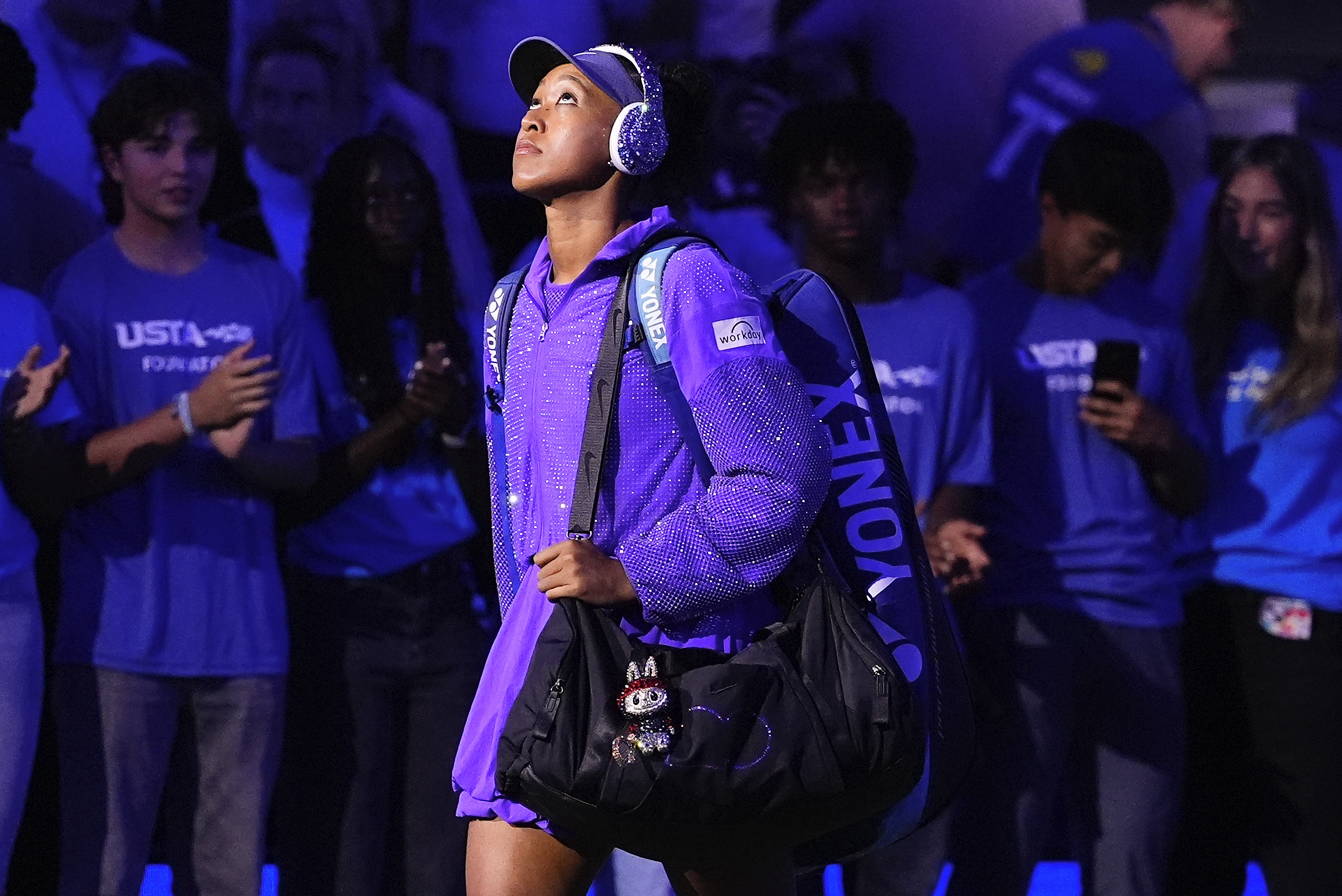 Naomi Osaka walks onto the court for her US Open semi-final against Amanda Anisimova on Thursday with a Labubu doll hanging from her bag. Photo: AP