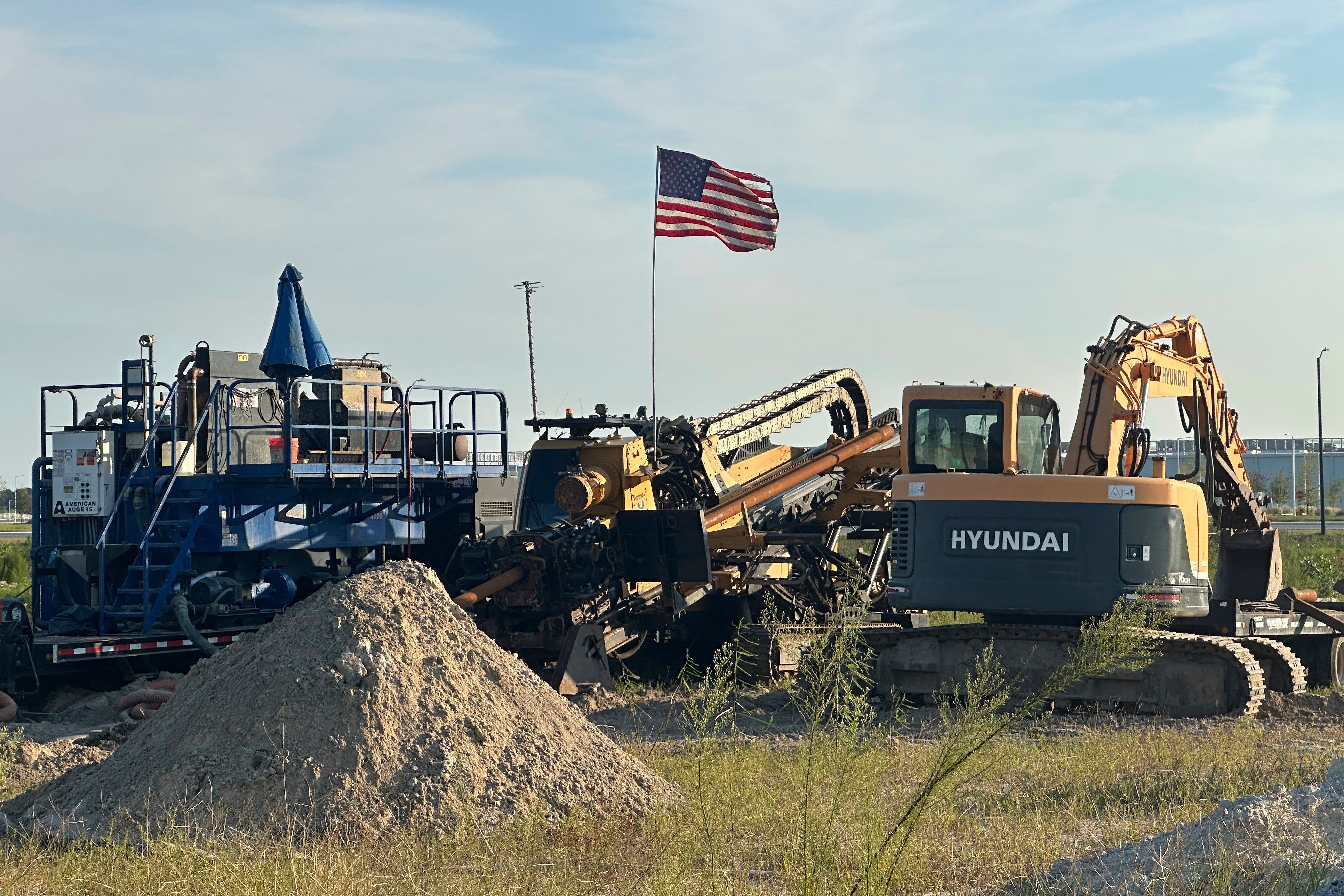 An American flag flies above a piece of heavy machinery at the site of Hyundai Motor Group’s electric vehicle plant in Ellabell, Georgia, on Friday. Photo: AP