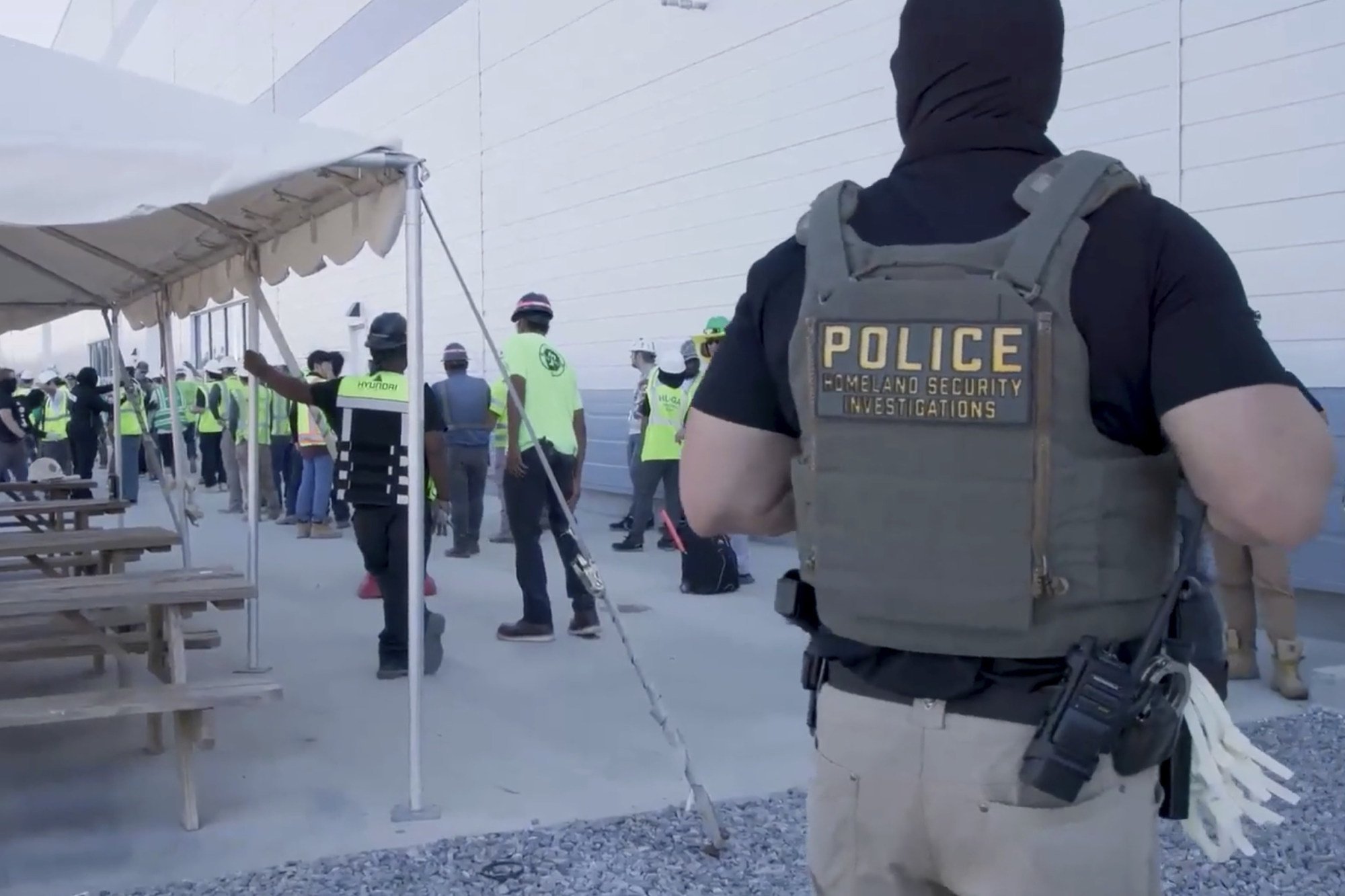 Workers being escorted on Thursday. Photo: US Immigration and Customs Enforcement via AP