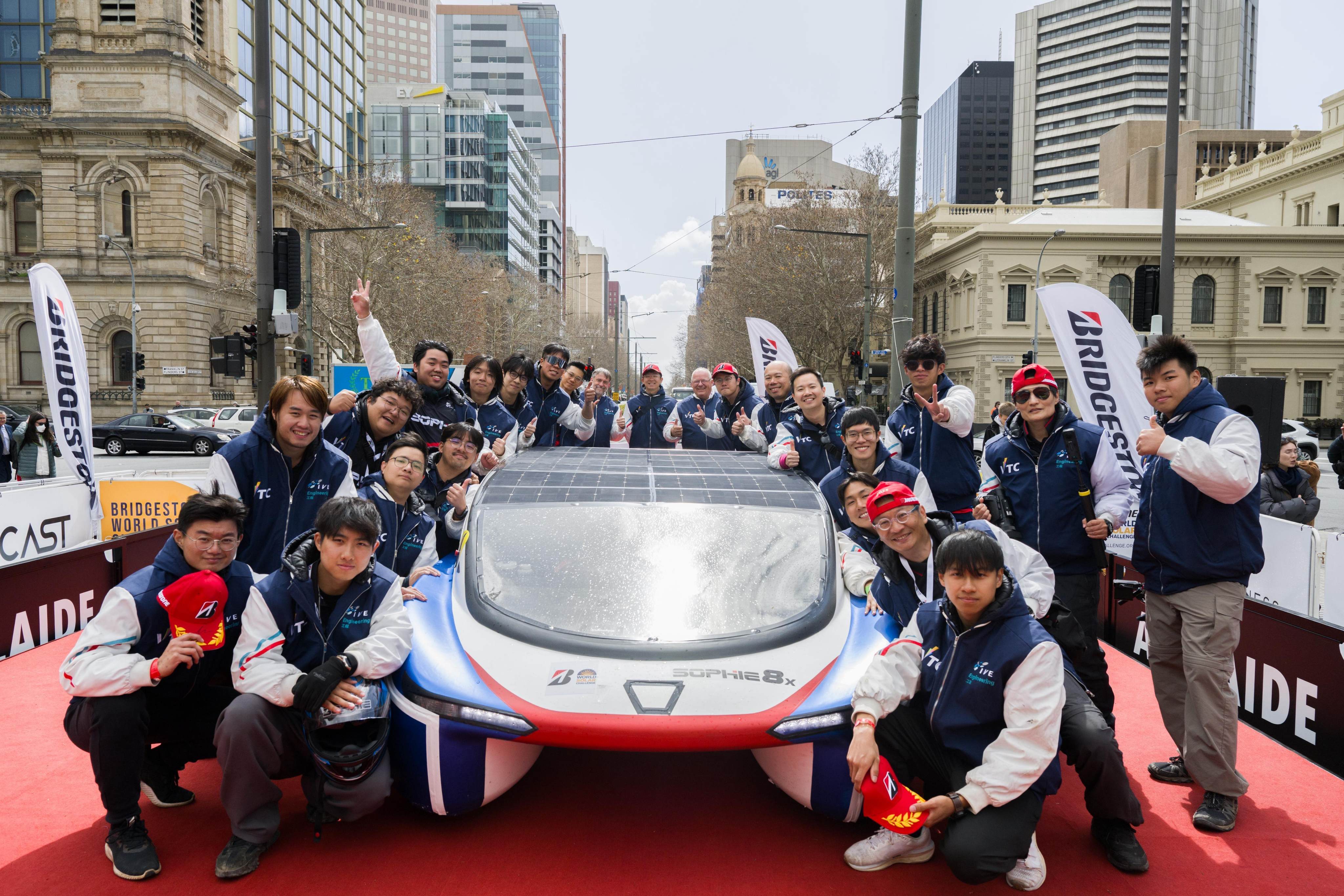 Sophie 8X, representing the Hong Kong Institute of Vocational Education, with her crew at the finish line in Adelaide. Photo: IVE