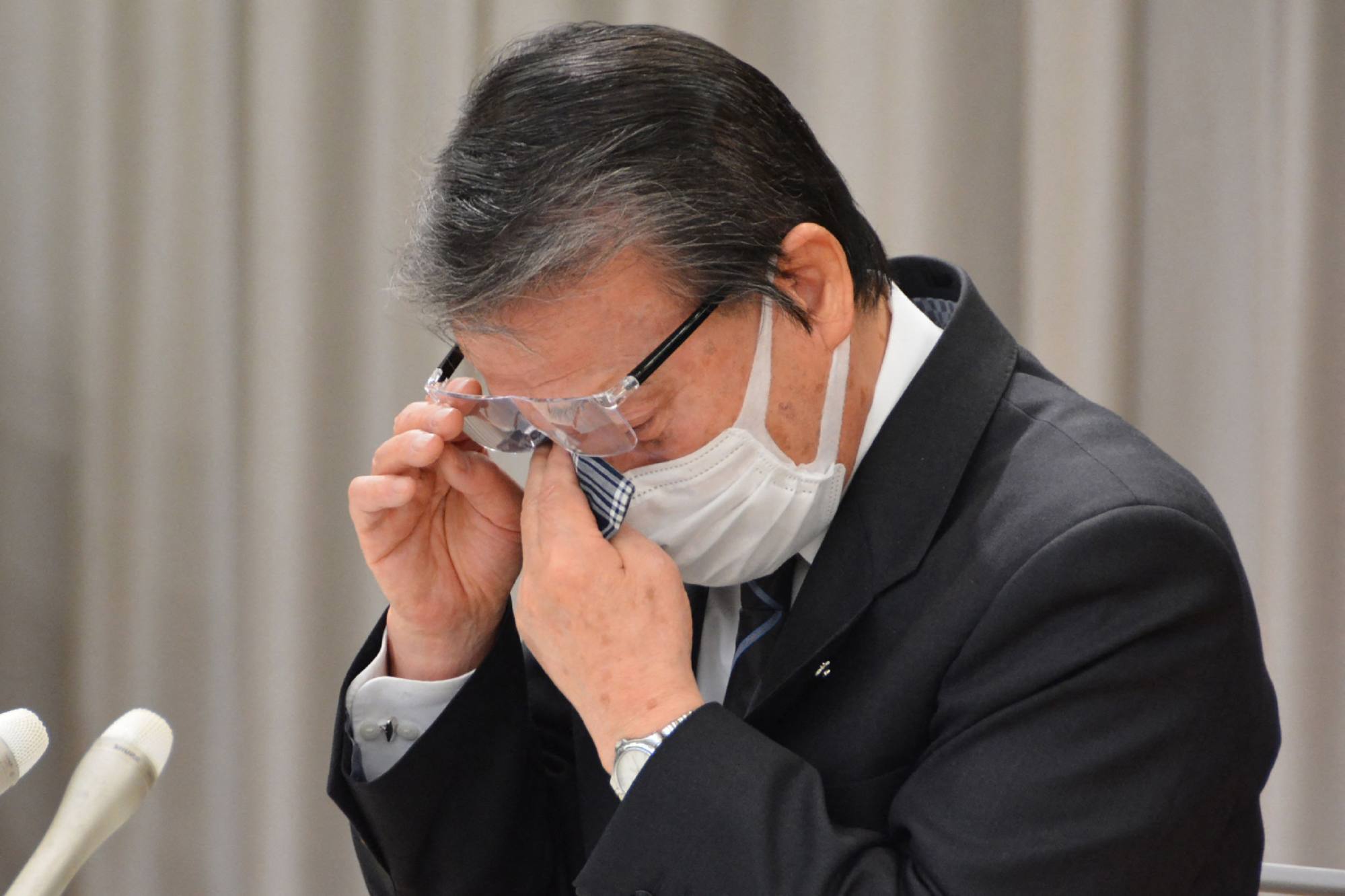 Mayor Hideo Kojima wiping away tears during a press conference in the town of Ginan, Gifu prefecture, on February 28, 2024. Photo: Jiji Press / AFP