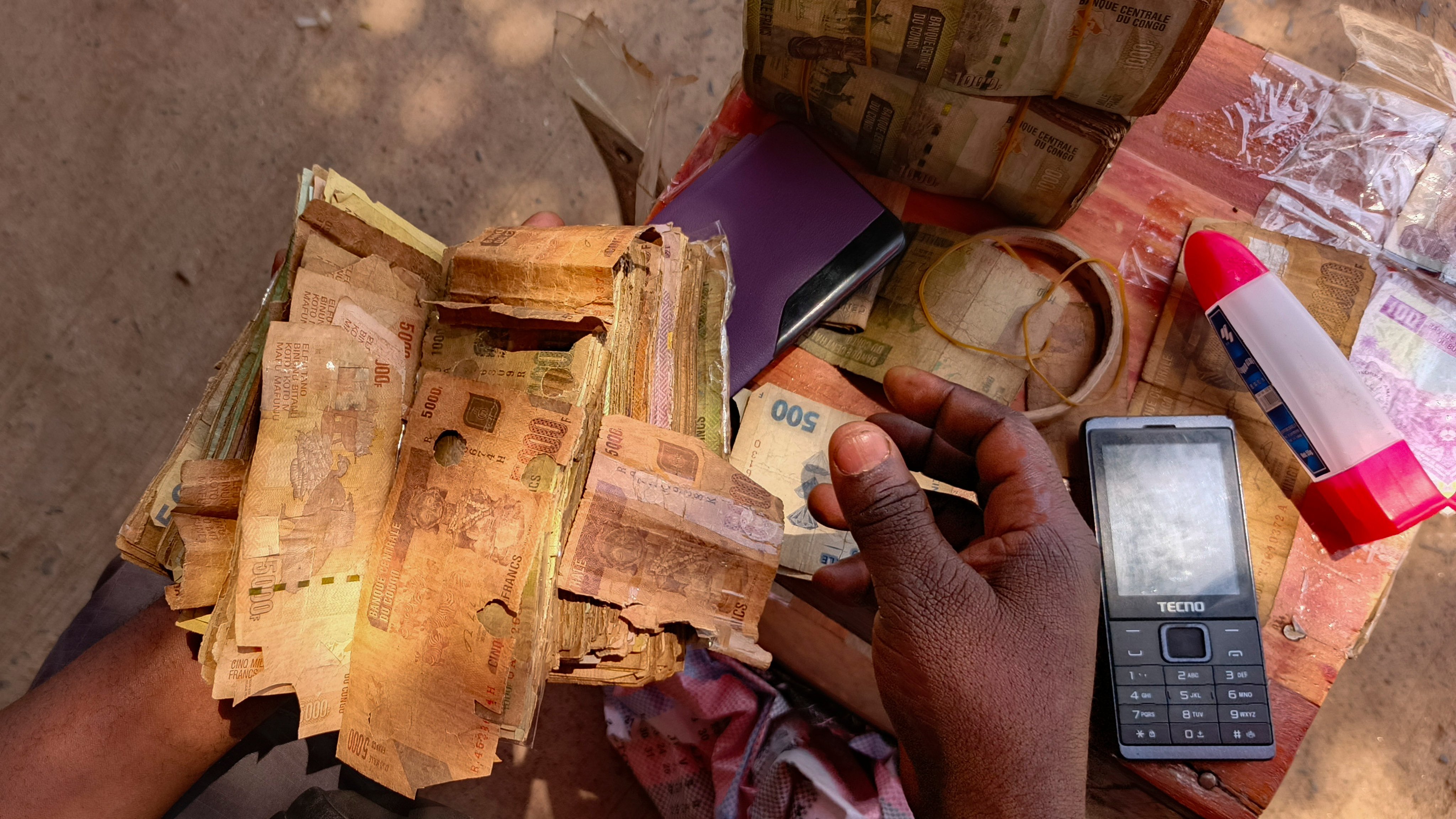 Perforated notes are seen in Bukavu, Democratic Republic of Congo, on August 29. Photo: AP