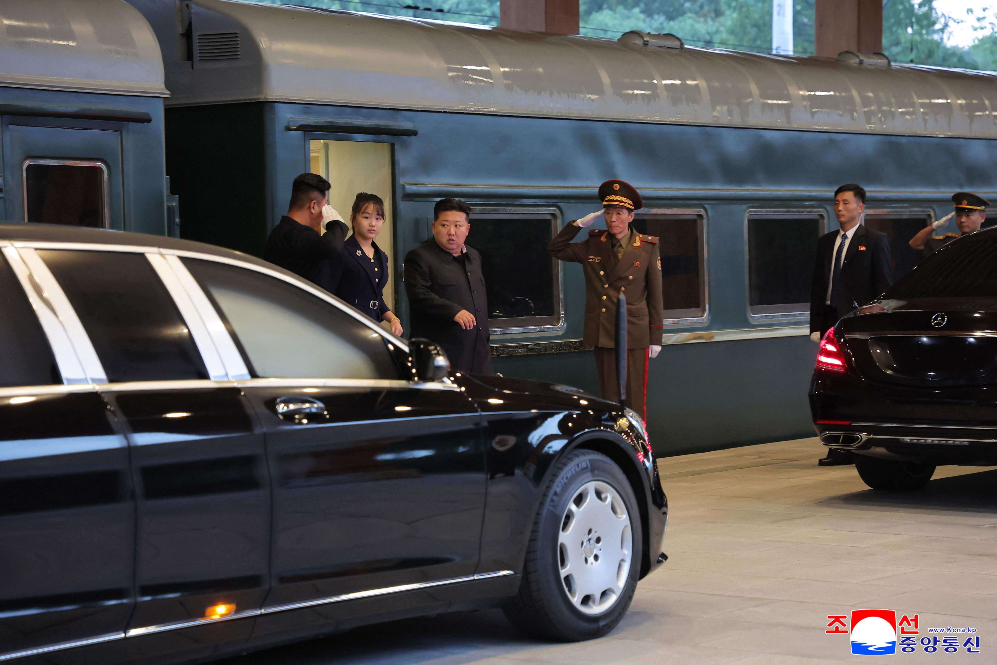 North Korean leader Kim Jong-un and his daughter Ju-ae (second from left) arrive back in Pyongyang on Friday after returning from China. Photo: KCNA/KNS /AFP